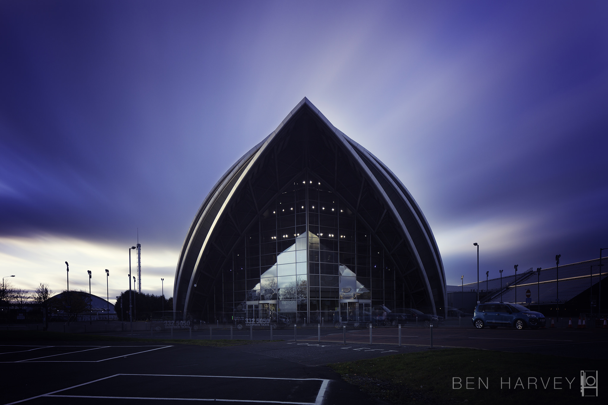 A colour version of the sun setting behind the Armadillo