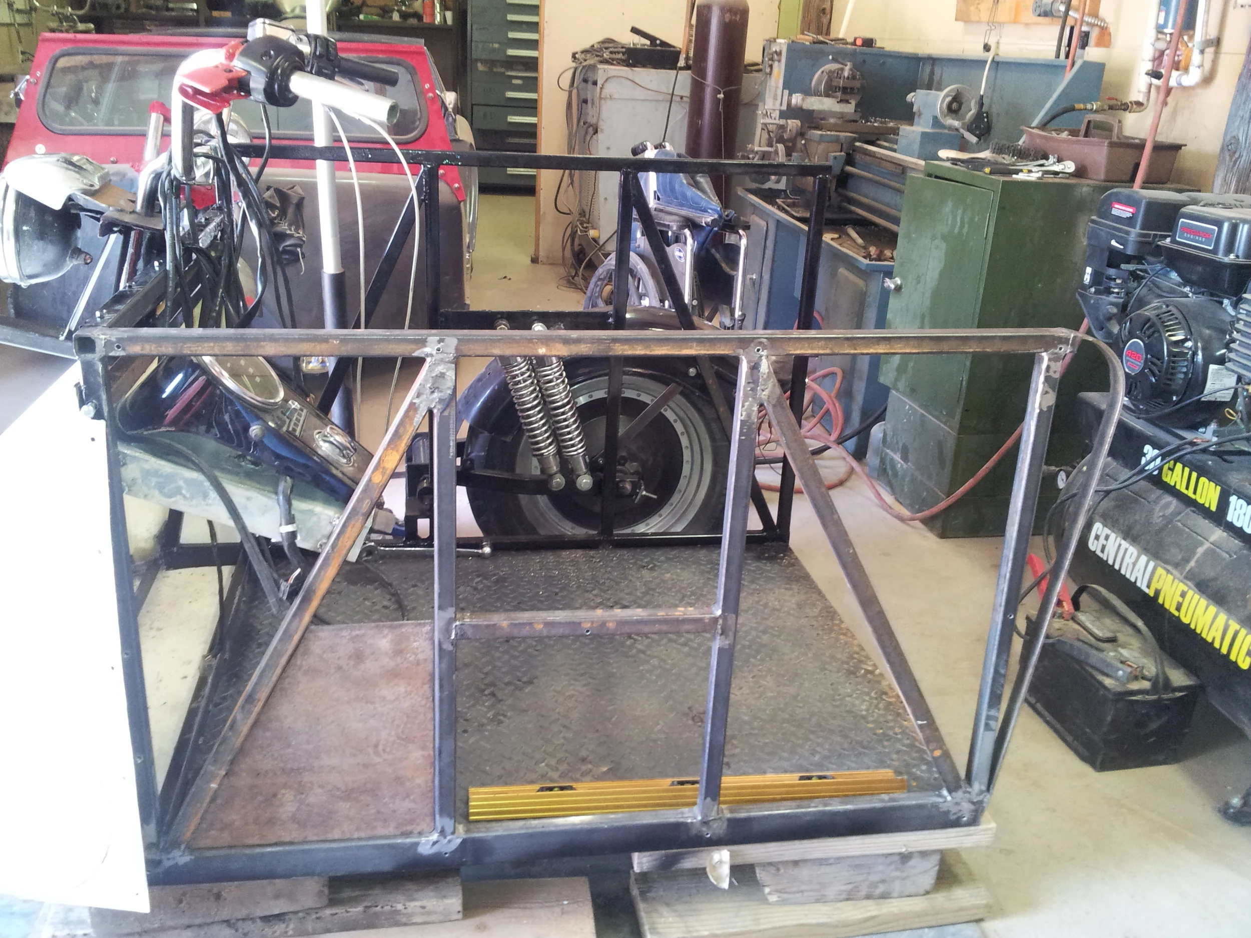 The handlebars and dash were relocated from the motorcycle and mounted to the sidecar