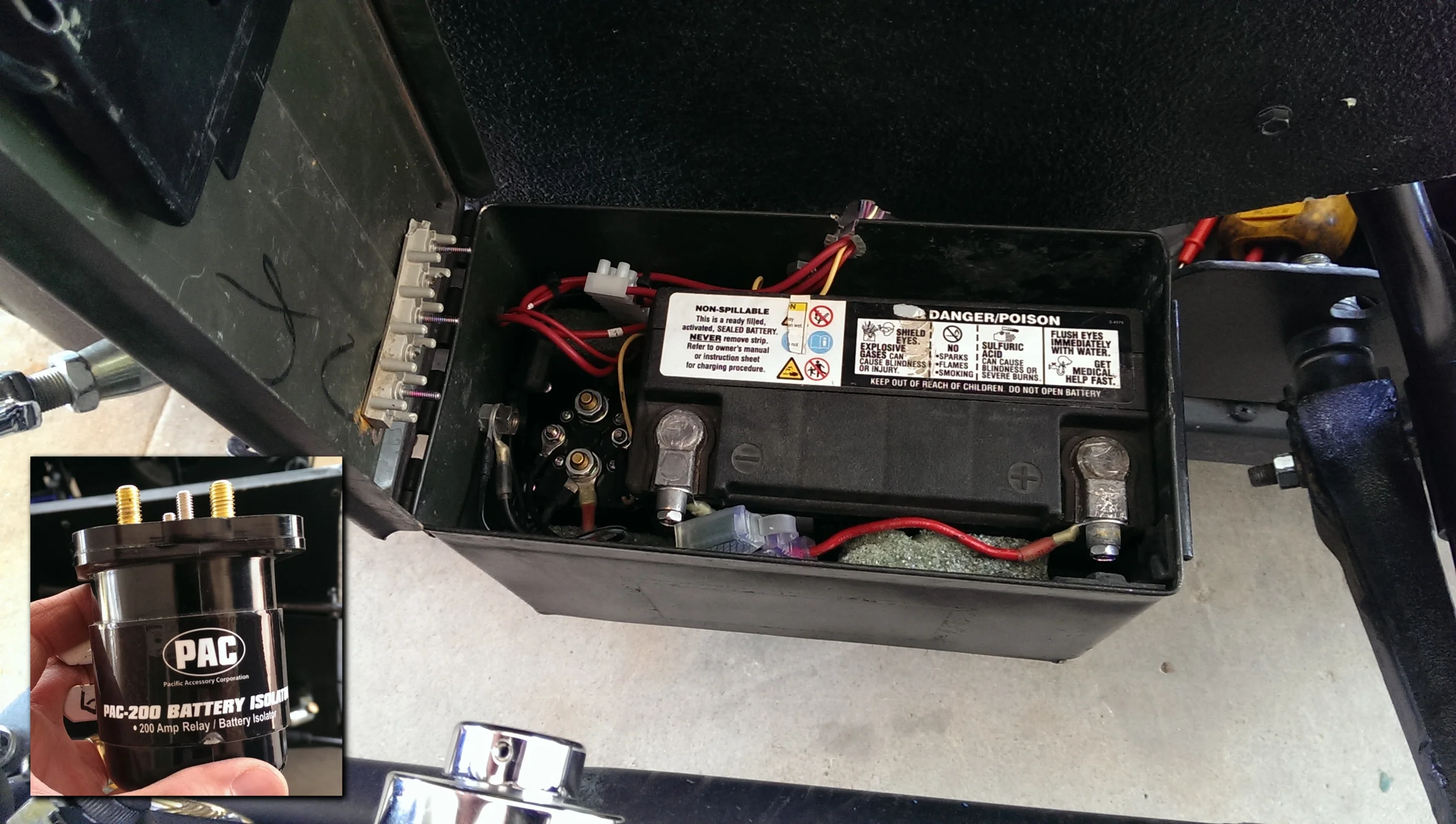 A battery box mounted on the side provides power to the gate lift motor. The battery isolator shown on the left of the case, allows the battery to charge from the bikes charging system while isolating the battery when the bike is off.