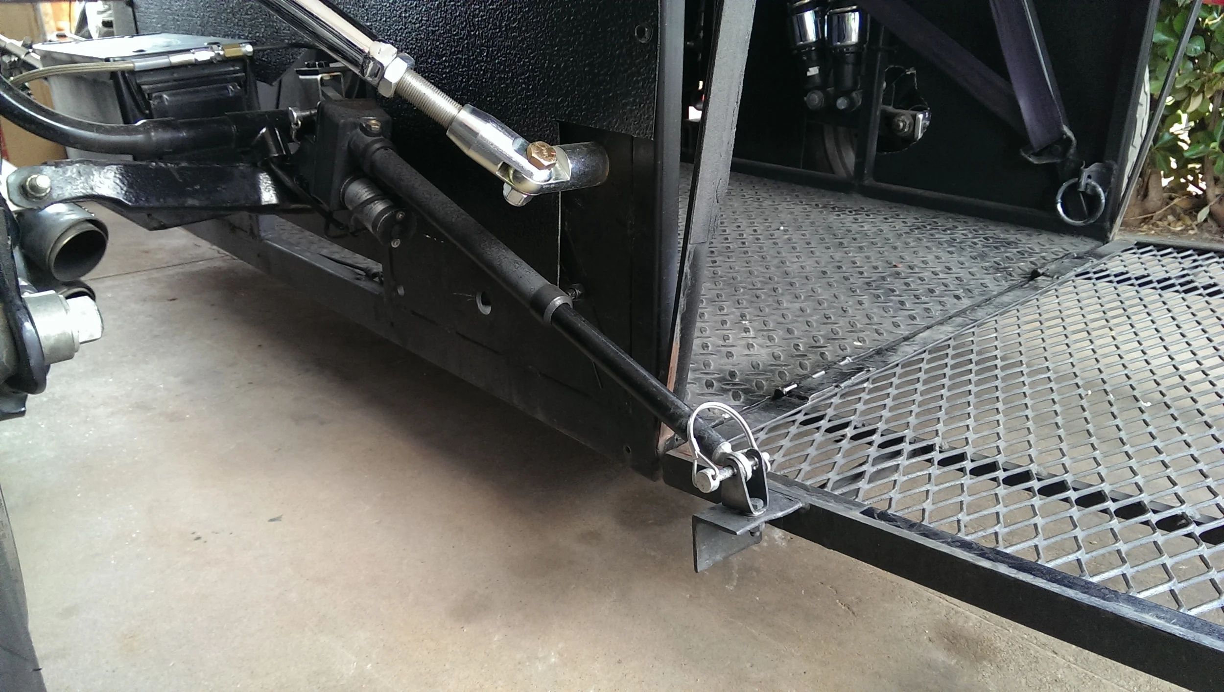 Opening and closing of the lift gate is done using this Linear actuator purchased through ebay . Removable pins are used to attach the actuator in the event the battery or actuator fail.