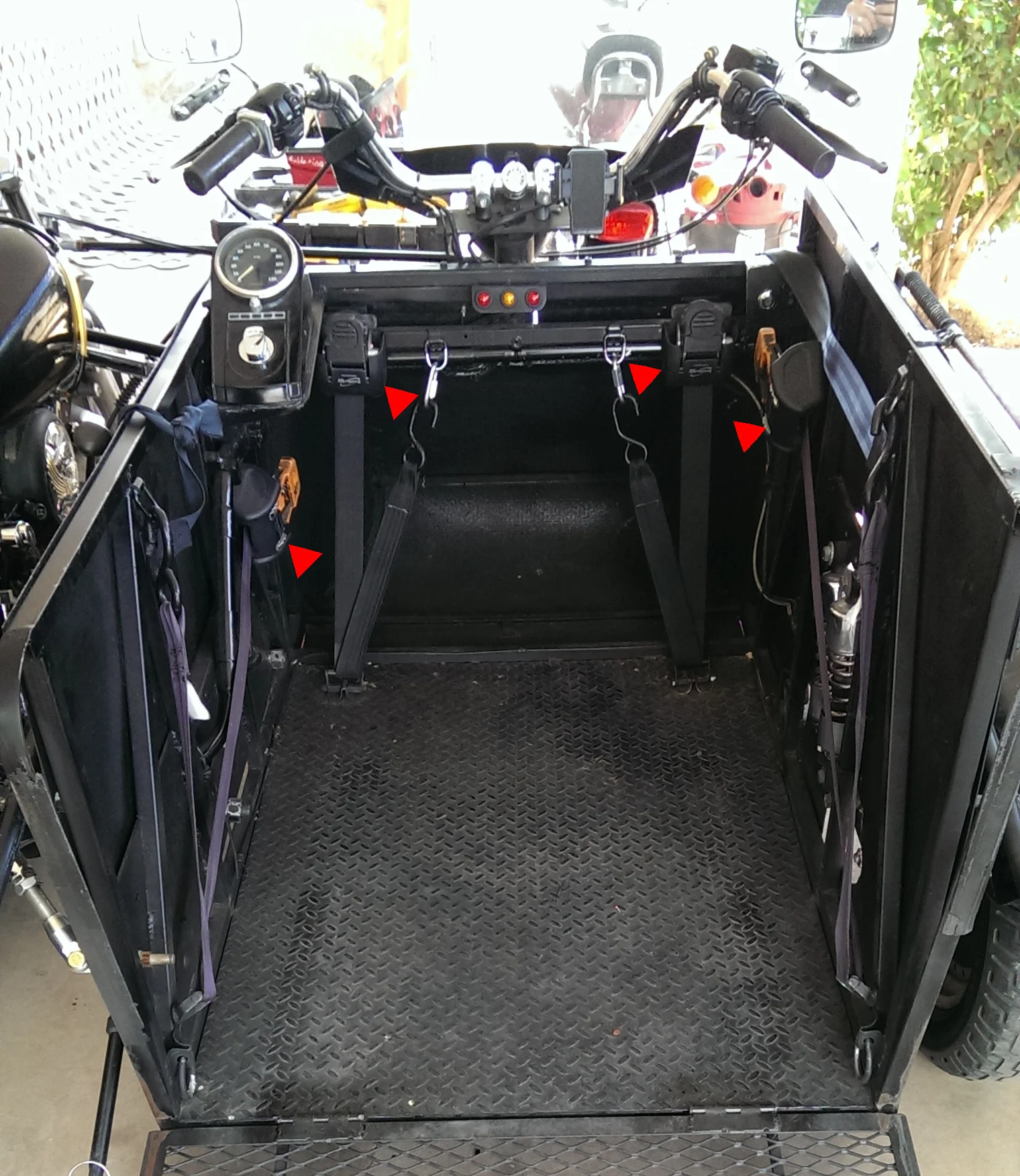 4 ratchet straps purchased from etrailer.com are used to secure the wheelchair to the compartment.