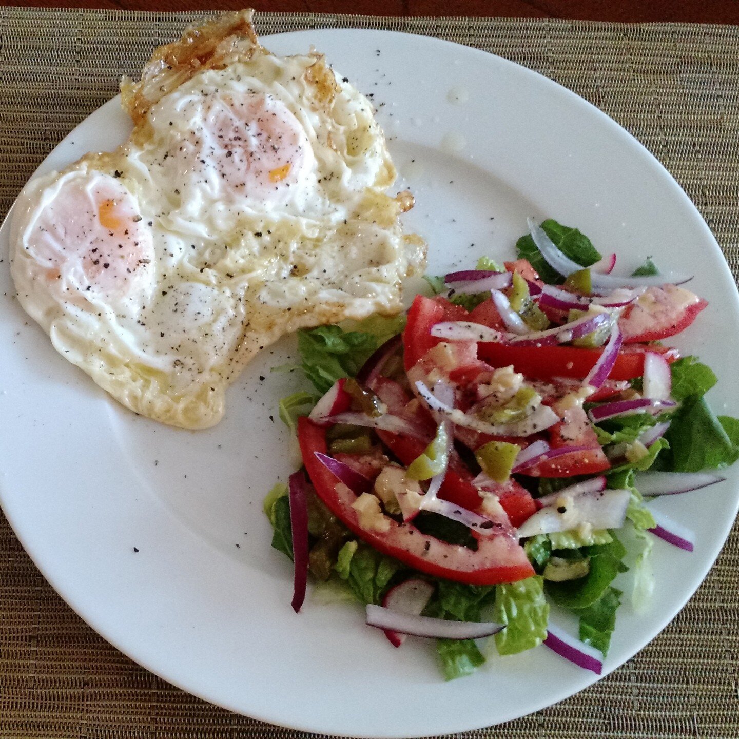 Breakfast of fried eggs and garden salad (protein &amp; veg.) to get our day started.

#breakfast #eggs #salad #nutrition