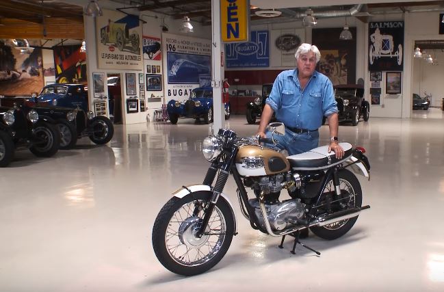 Jay Leno and his Bonnie in his famous garage