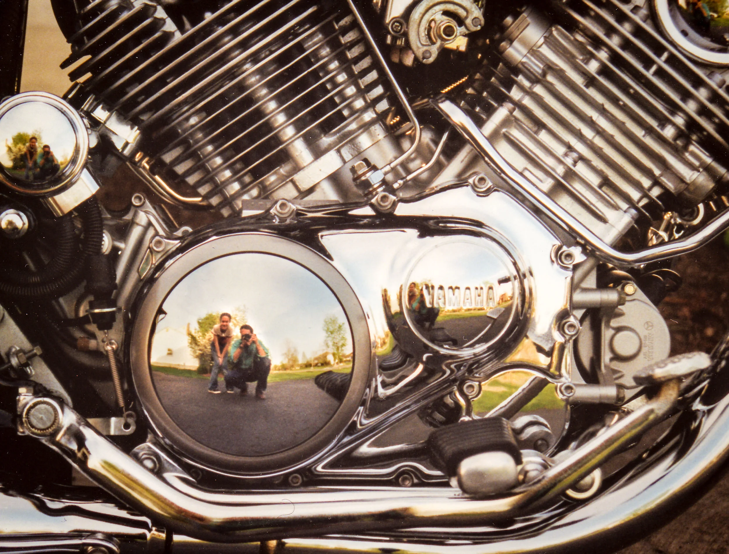Amy and me reflected in the chromed crankcase of my last Yamaha 