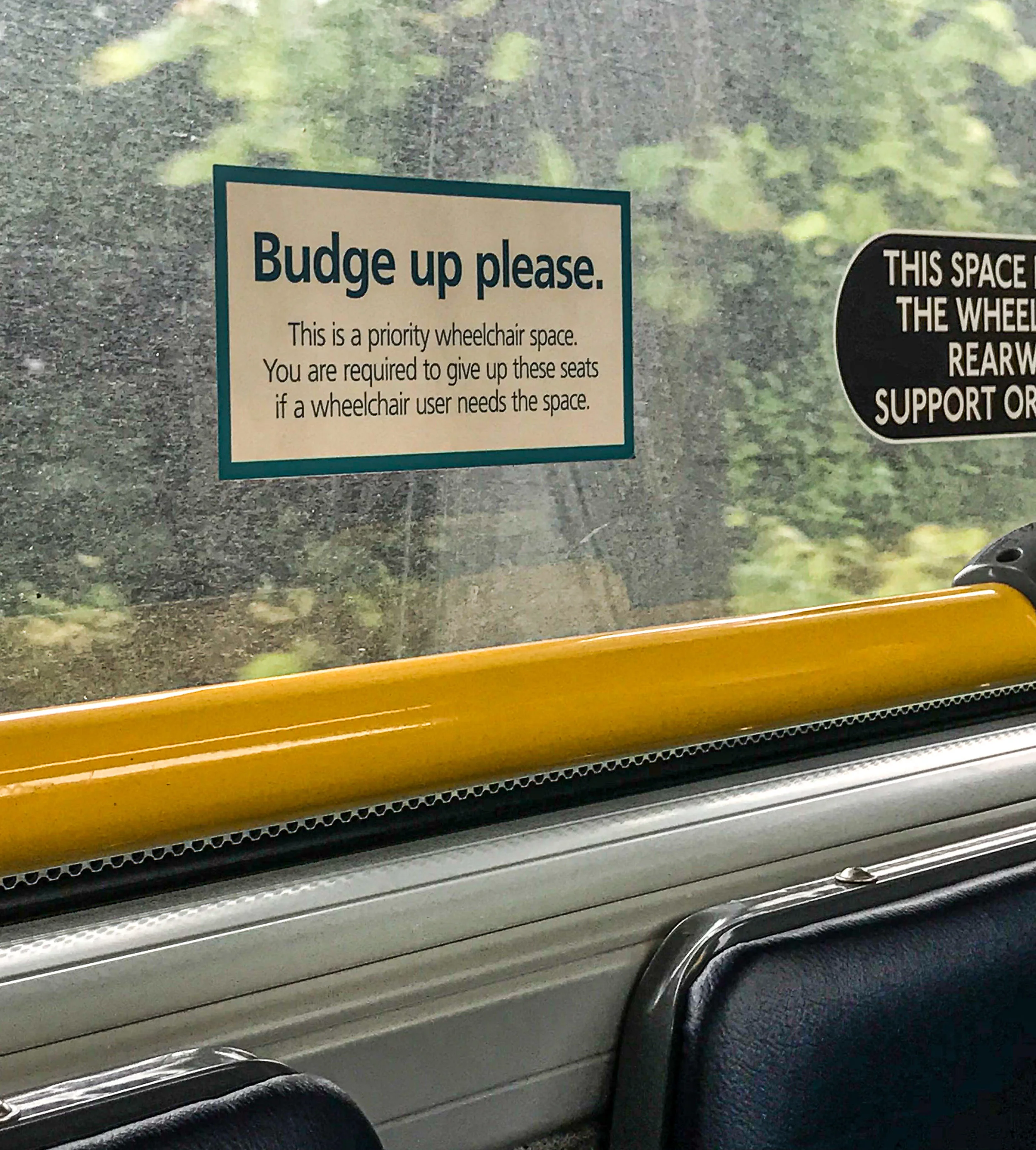 A sign in the bus next to my seat. Gotta luv this Brit-speak!