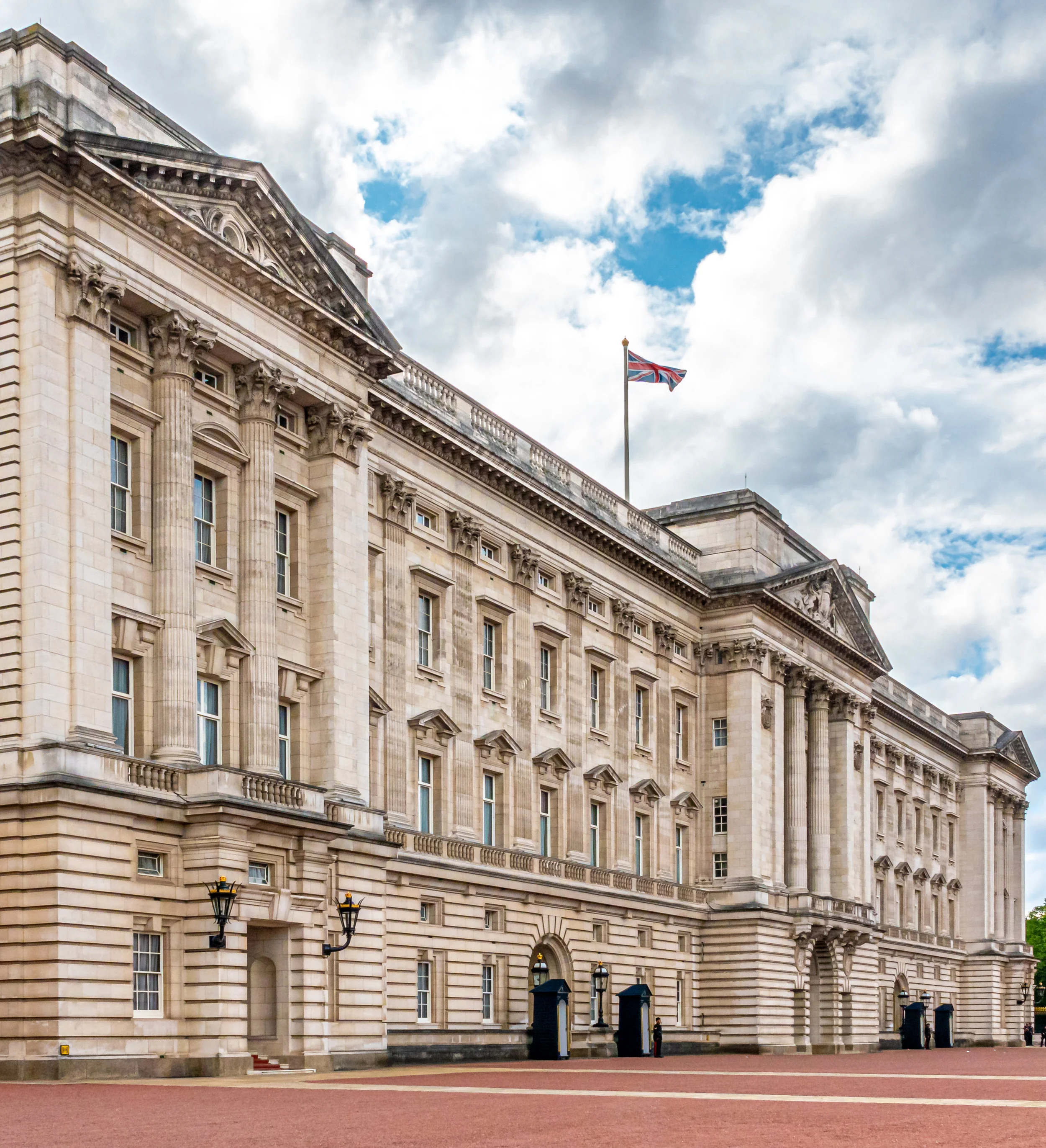 Buckingham Palace without the rain. The Union Jack is flying. That means the Queen is not in residence (probably in Windsor Castle). When she’s there the flag of the Royal Family flies instead.