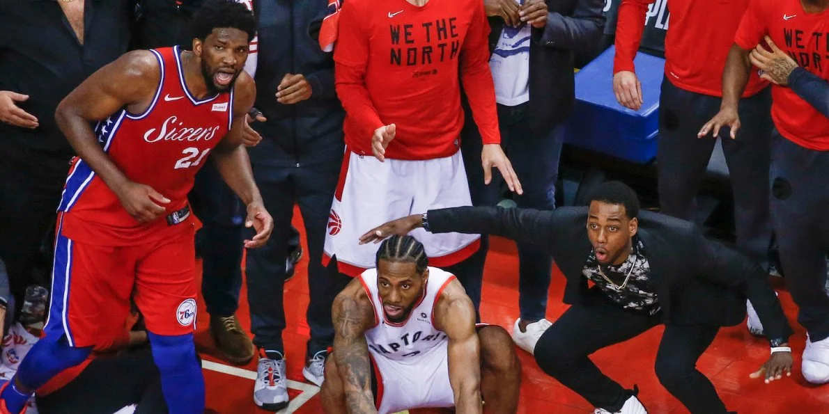 stunning-photo-captured-the-raptors-and-sixers-watching-kawhi-leonards-series-winning-shot-bounce-around-the-rim.jpg