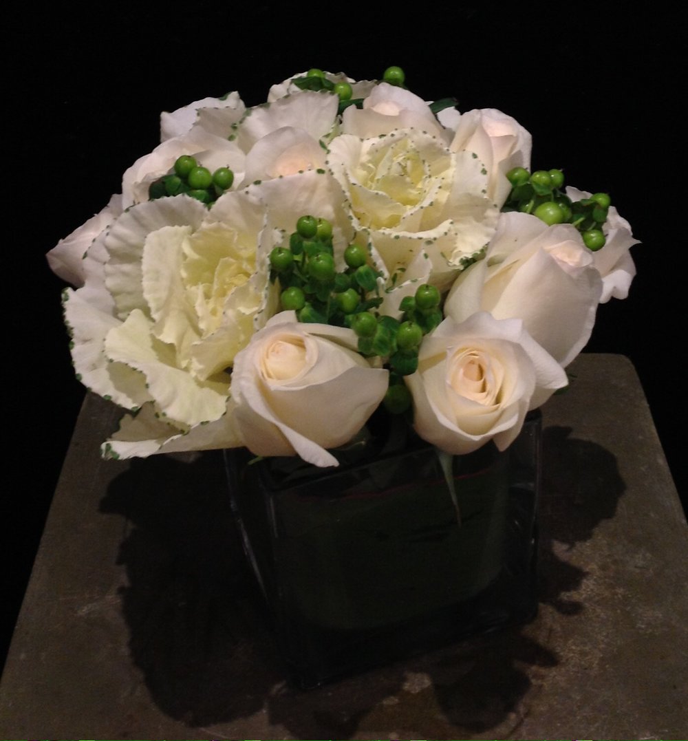 Winter-themed flower arrangement with delphinium, hyacinths, callas,  hydrangeas, roses,…