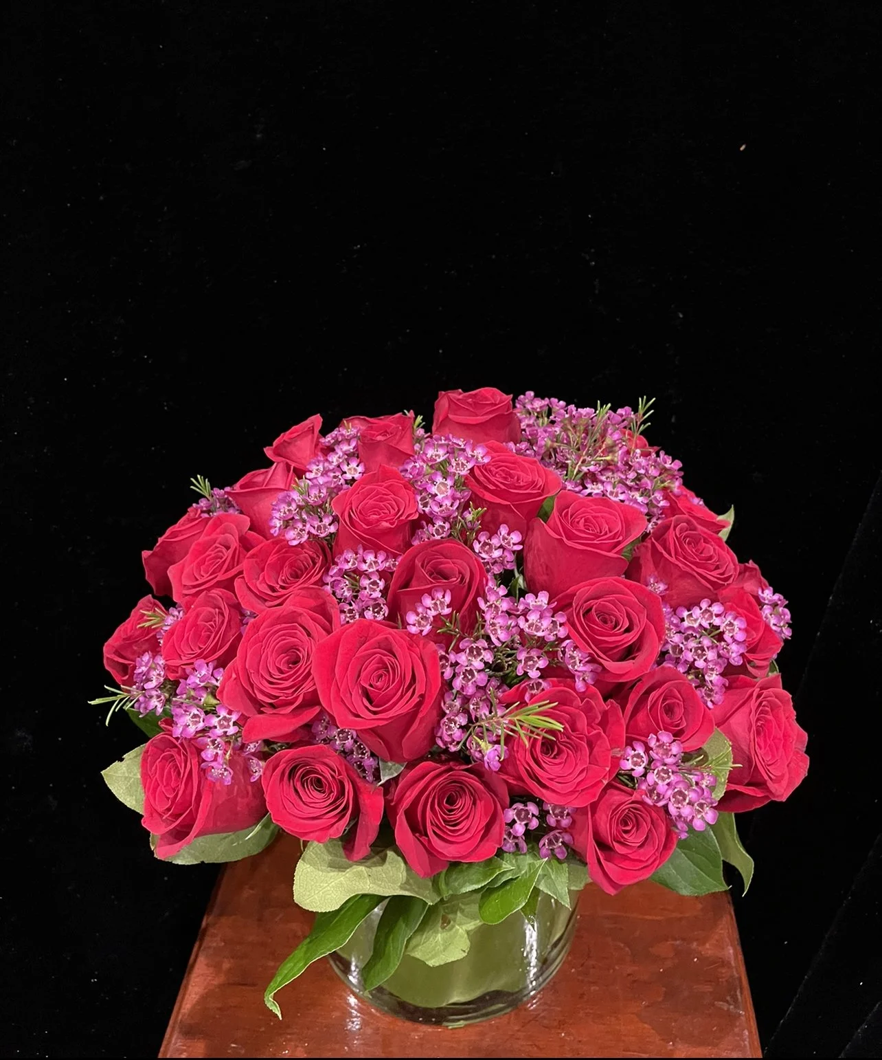 4-dozen-red-roses-waxflowers.jpeg