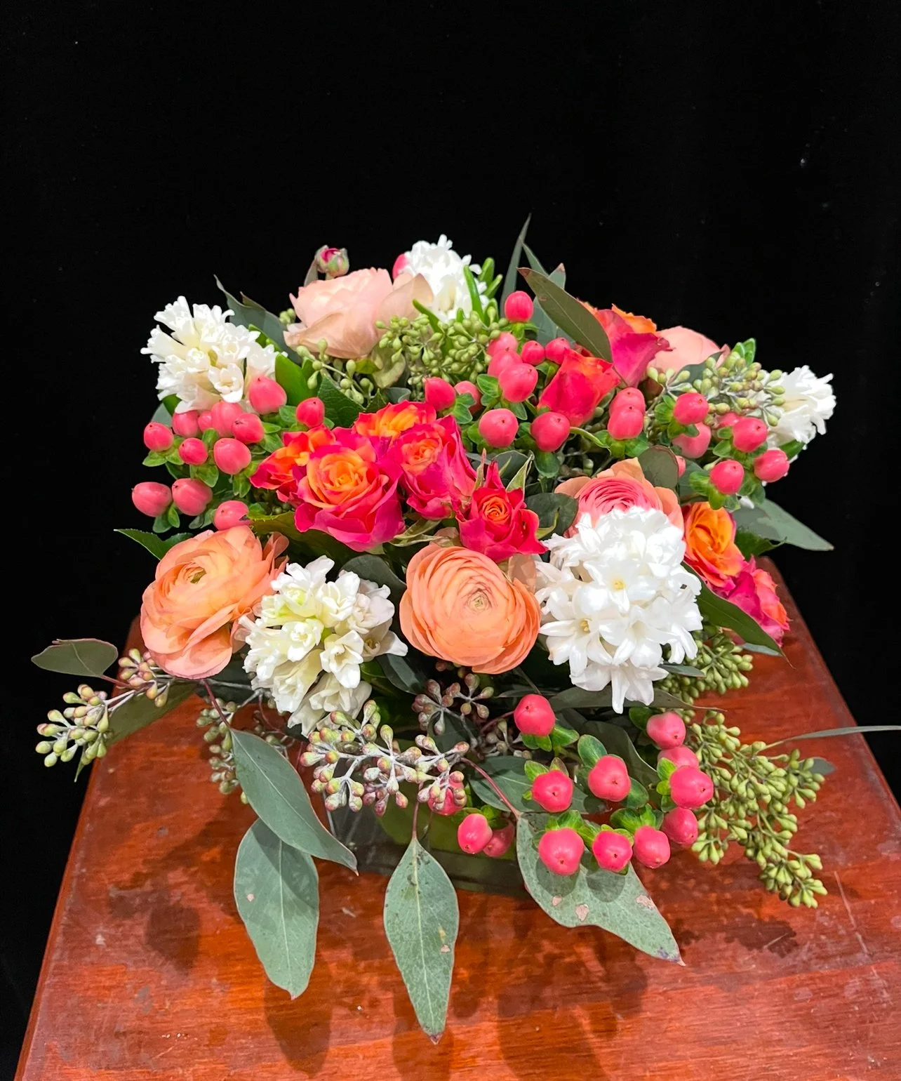 hycithus-spray-roses-hypericum-berries-ranunculus-seeded-eucalptus.jpeg