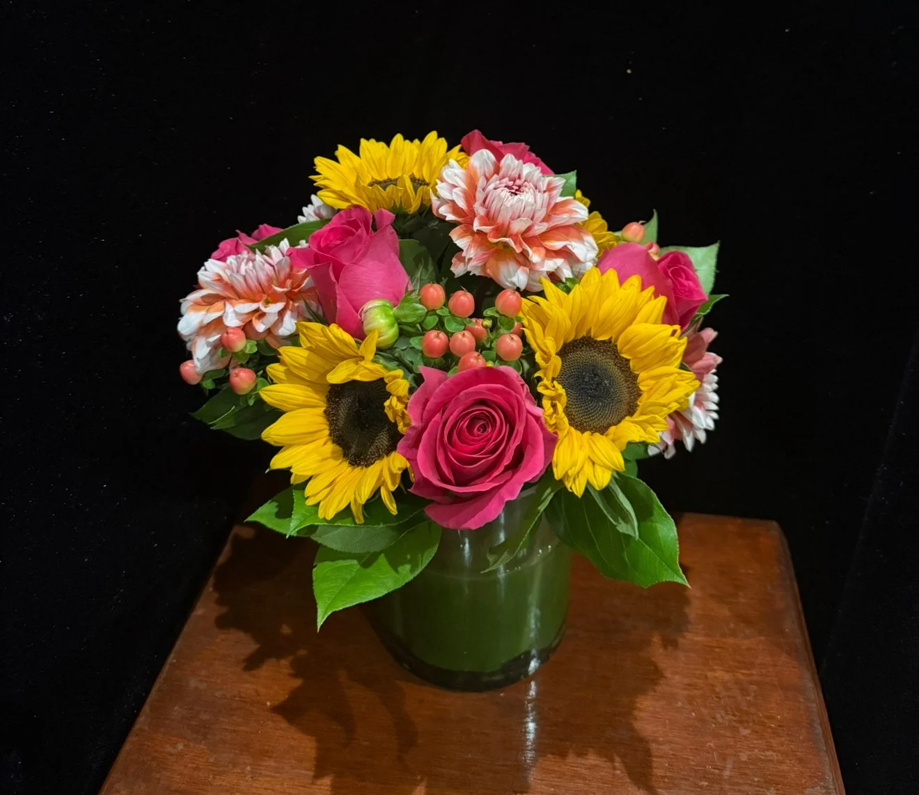 hot-pink-roses-sunflowers-dahlias-berries-greenery.jpeg