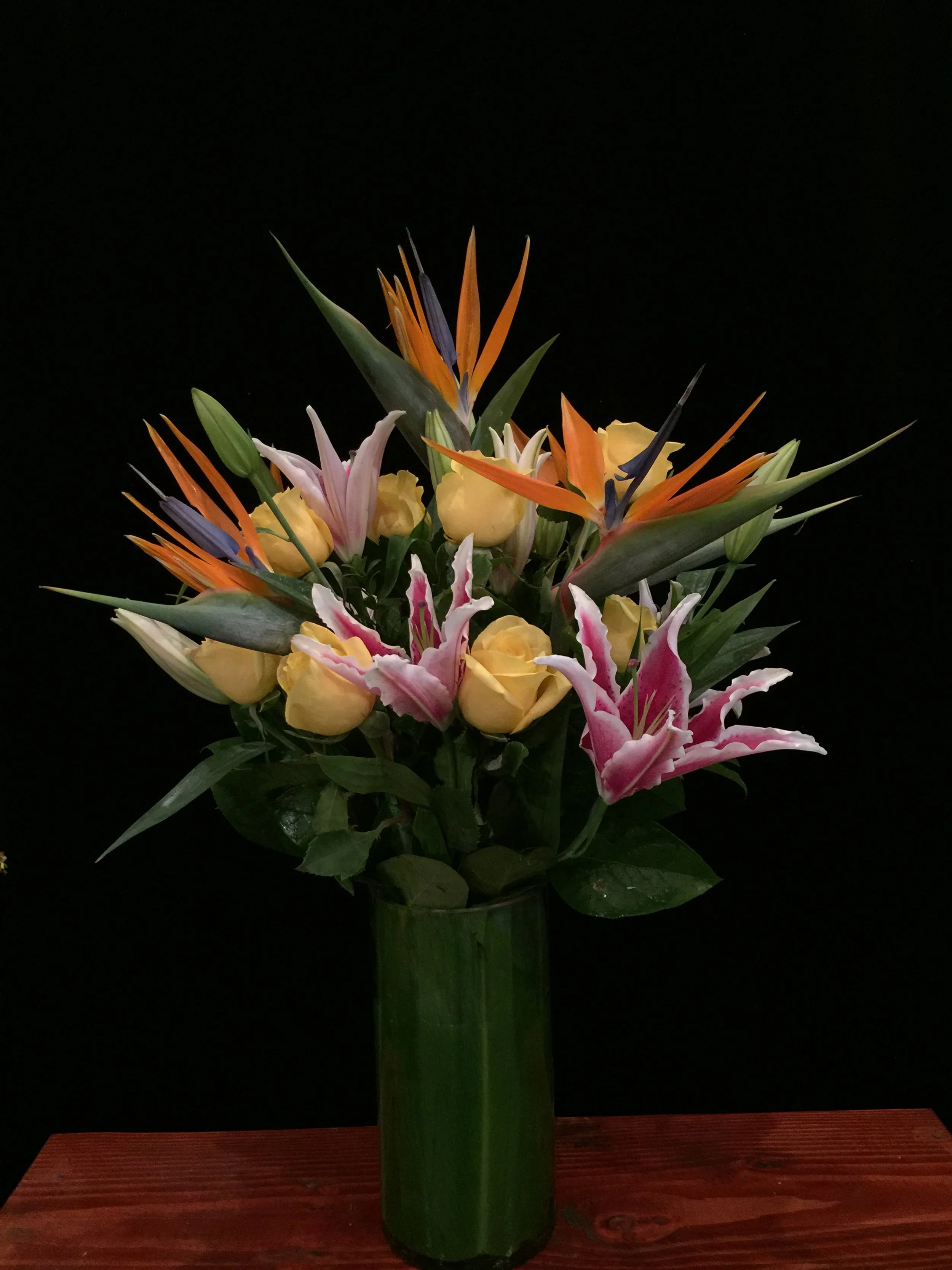 Dozen yellow roses - starfighter lilies- birds of paradise.JPG