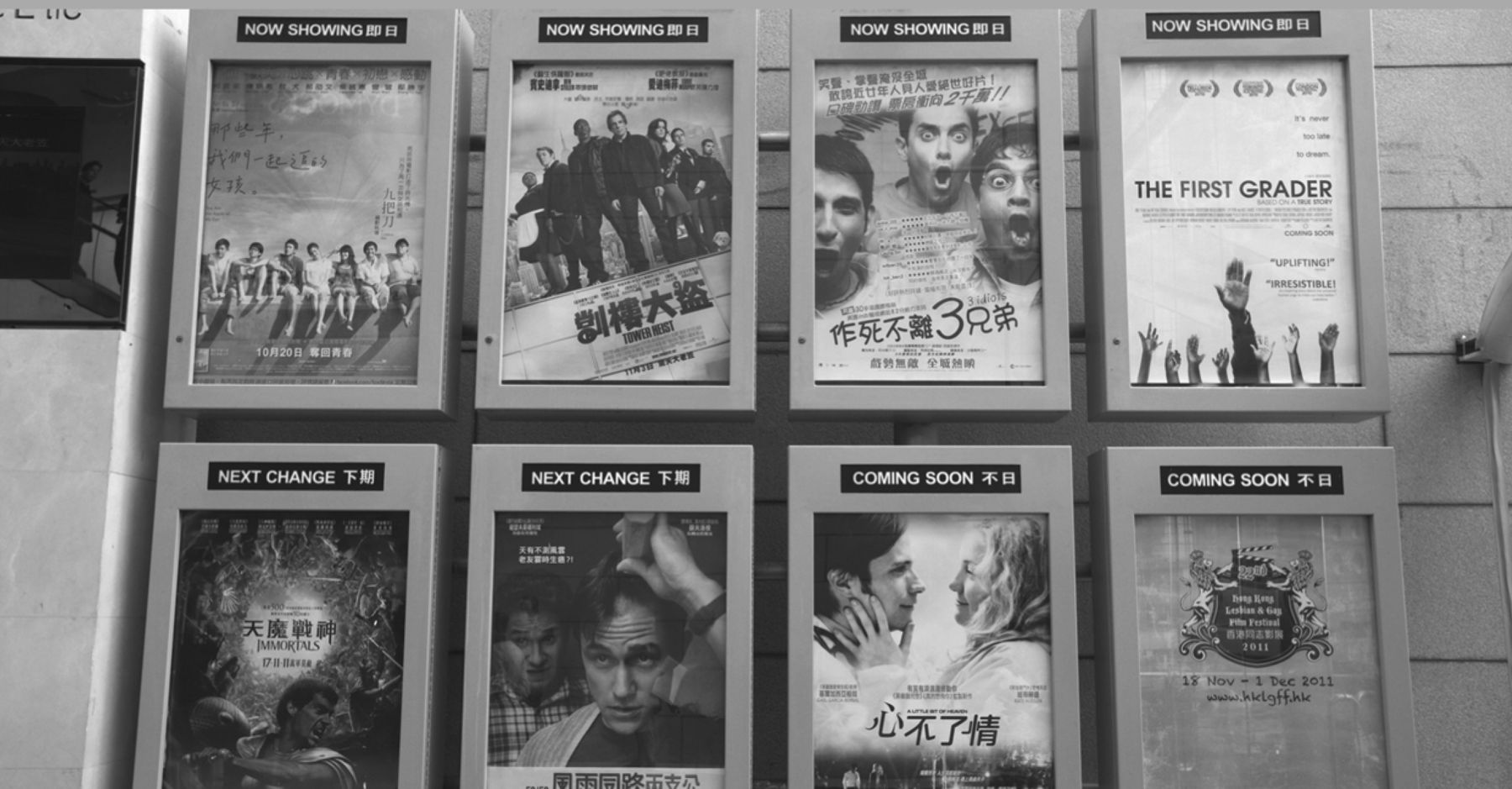 Bilingual Chinese and English movie posters at a multiplex in China. Photo: Joe Fox/Radharc Images/Alamy