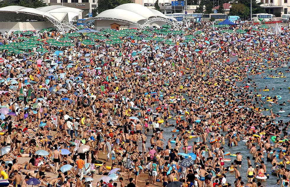 Crowds flock to a Qingdao beach in summer. Photo: Xinhua