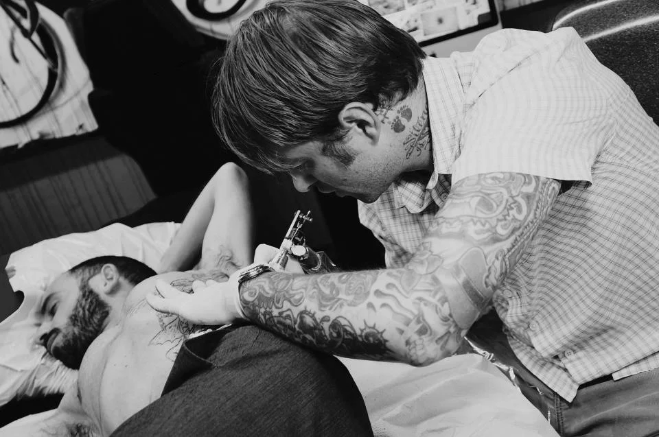 Photo of Jeffery Page @ Will Rise on Fairfax tattooing a St. Micheal on Kris the Designer taken by Myrin Mejia