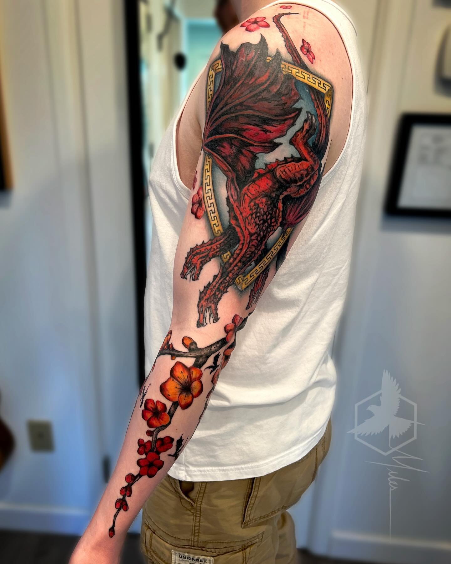 Continued working on this sleeve by adding a plum blossom branch flowing under the dragon sigil. Thank you Chris!