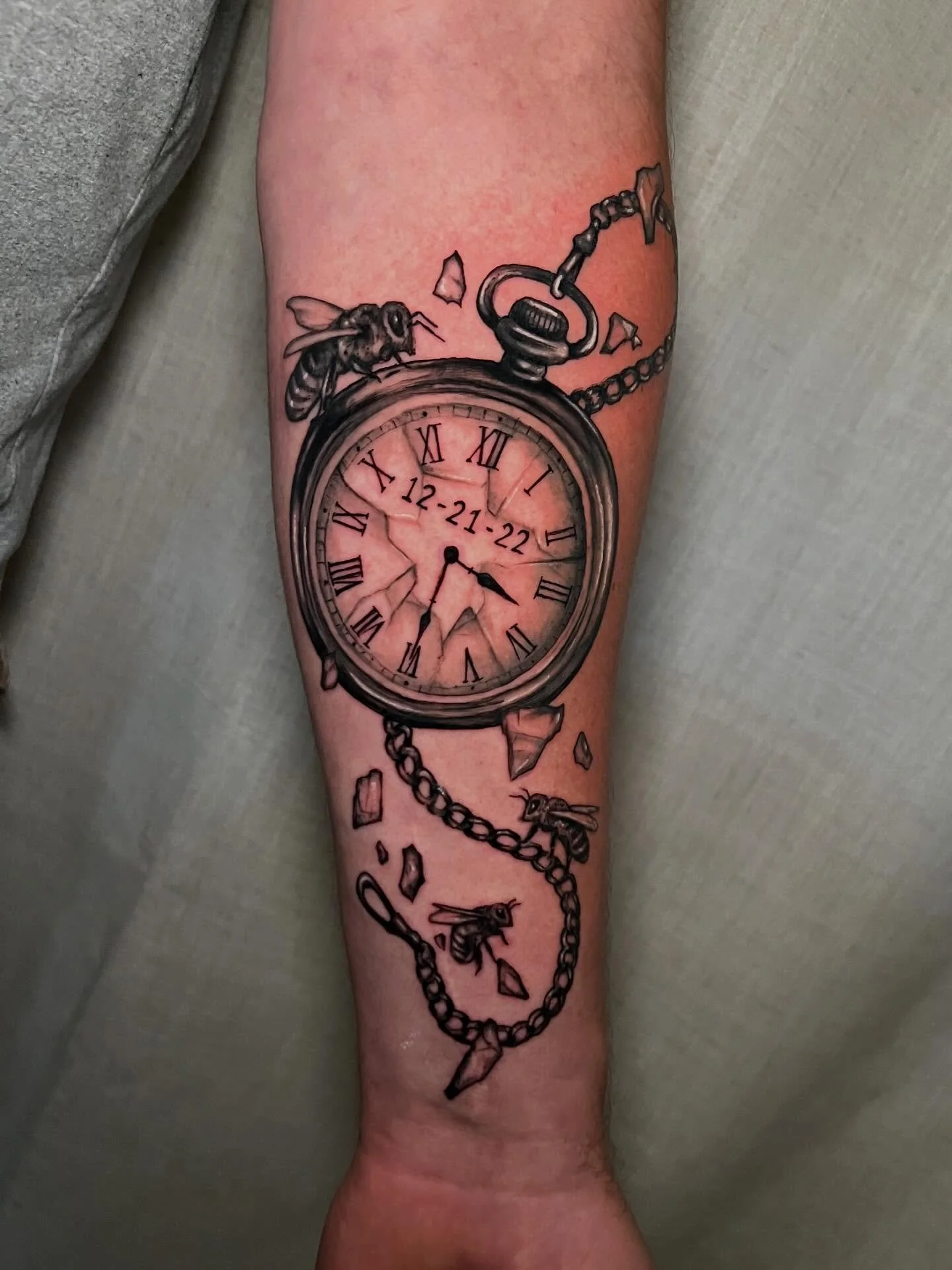 Another memorial tattoo honoring a life of service.

A pocket watch and bees, symbolizing time, dedication, and years as a Navy Seabee.