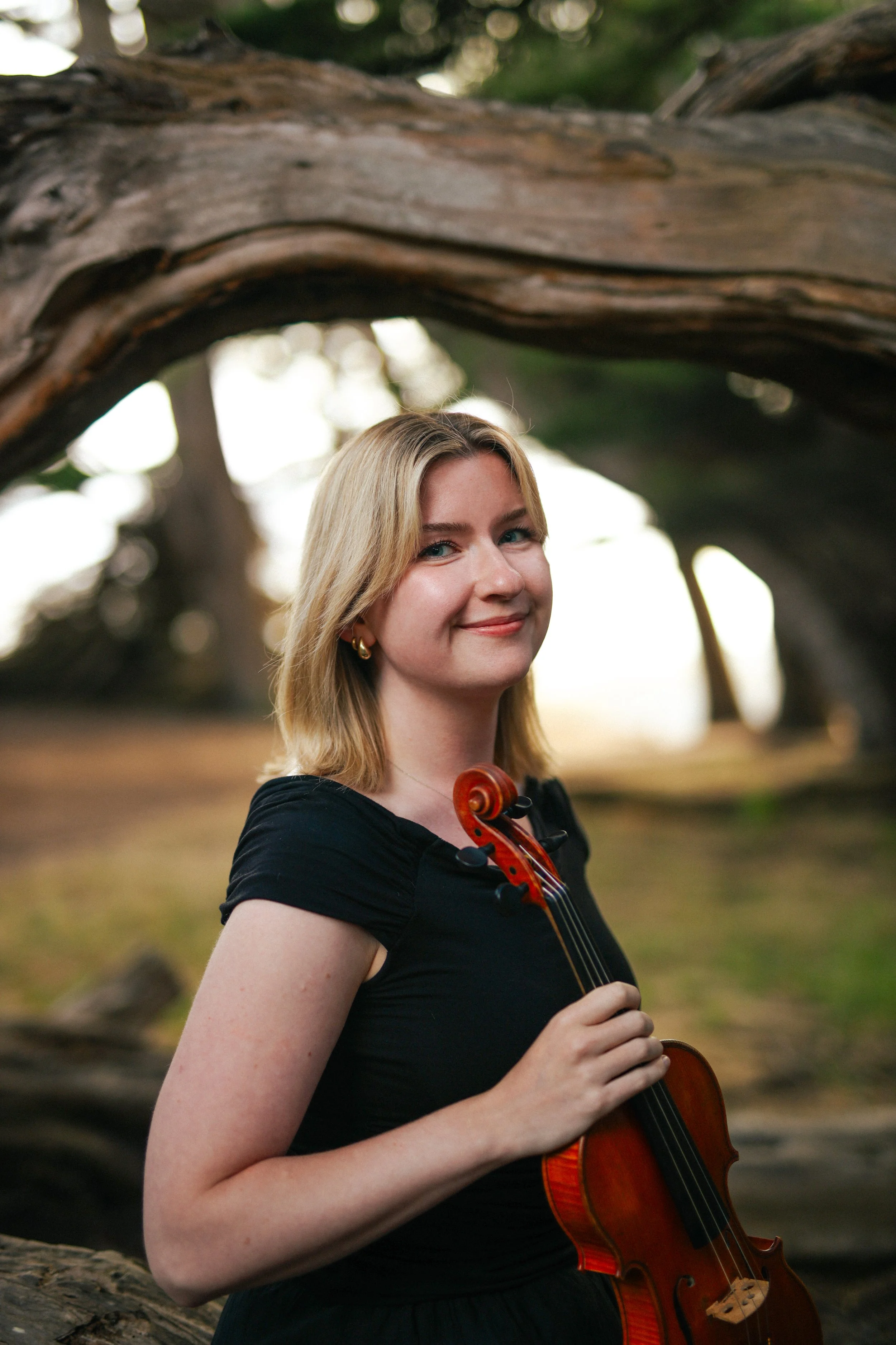 violinist portrait headshot in the woods