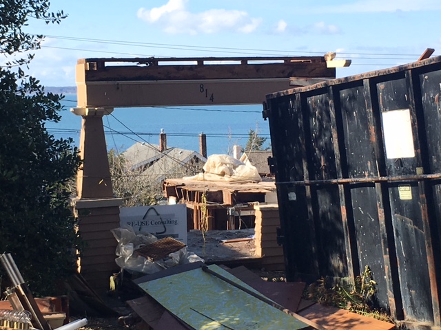 Making way for the new. An old craftsman residence is being disassembled on site to recycle and salvage materials. 