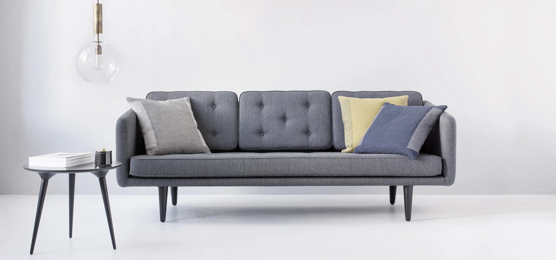 Home interiors with design couch by Fredericia furniture and pillows by Johannes Torpe Studios
