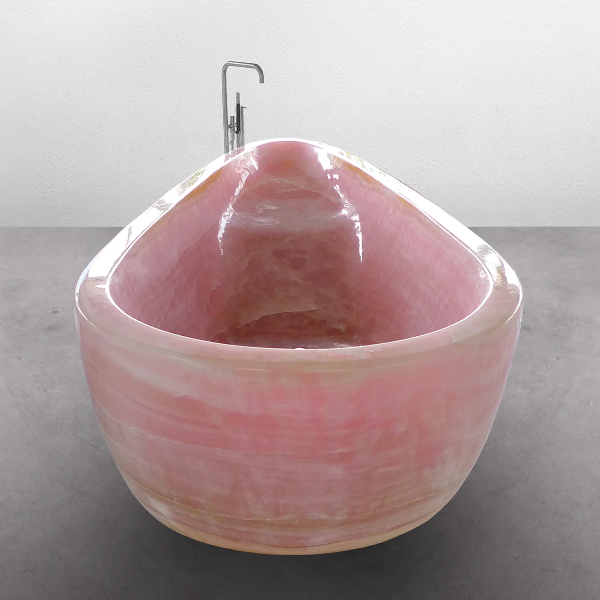 Pink bathtub cut out of one piece of onyx designed by Johannes Torpe Studios