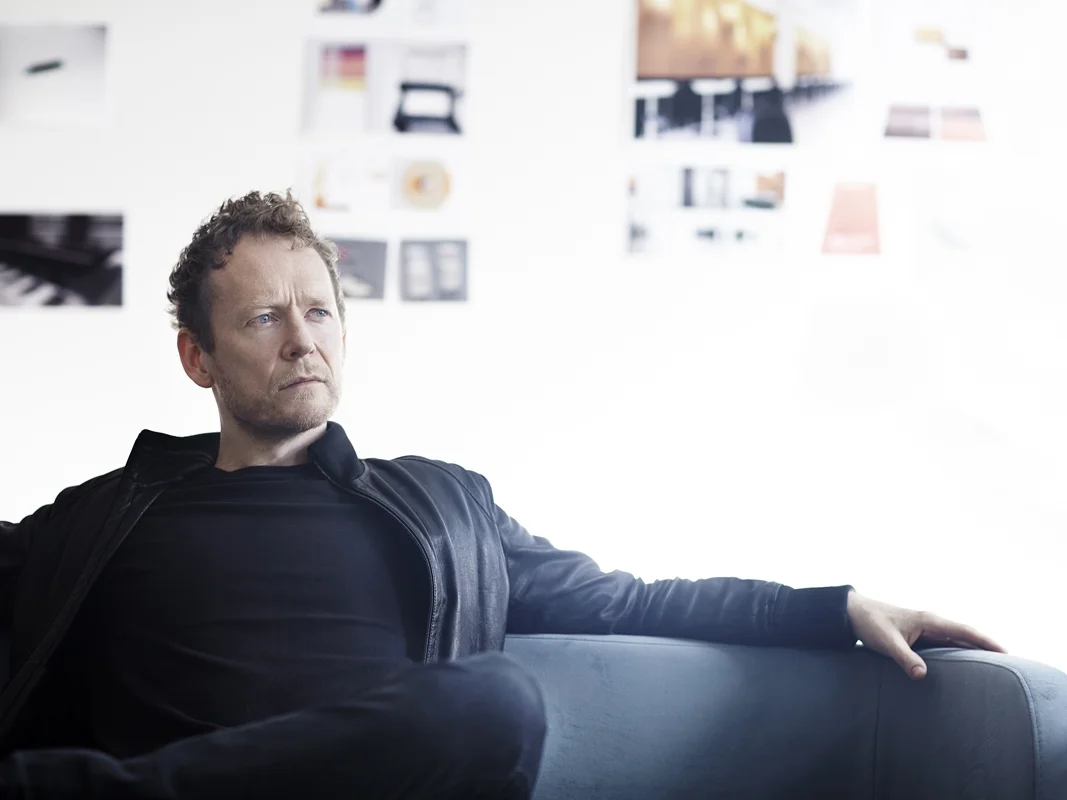 johannes-torpe-sitting-in-the-studio-sofa