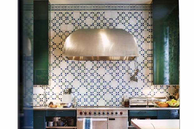 Emerald green cabinets and a wall of tiles -&nbsp;cleverly broken up with blank white tiles to alleviate and refresh&nbsp;the look of the&nbsp;repetitive pattern.