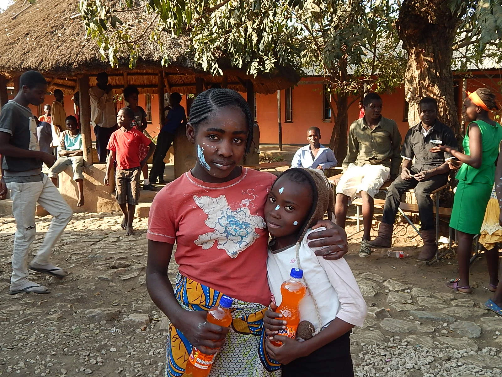 Naluyele, left, with her good friend Chilala, right.