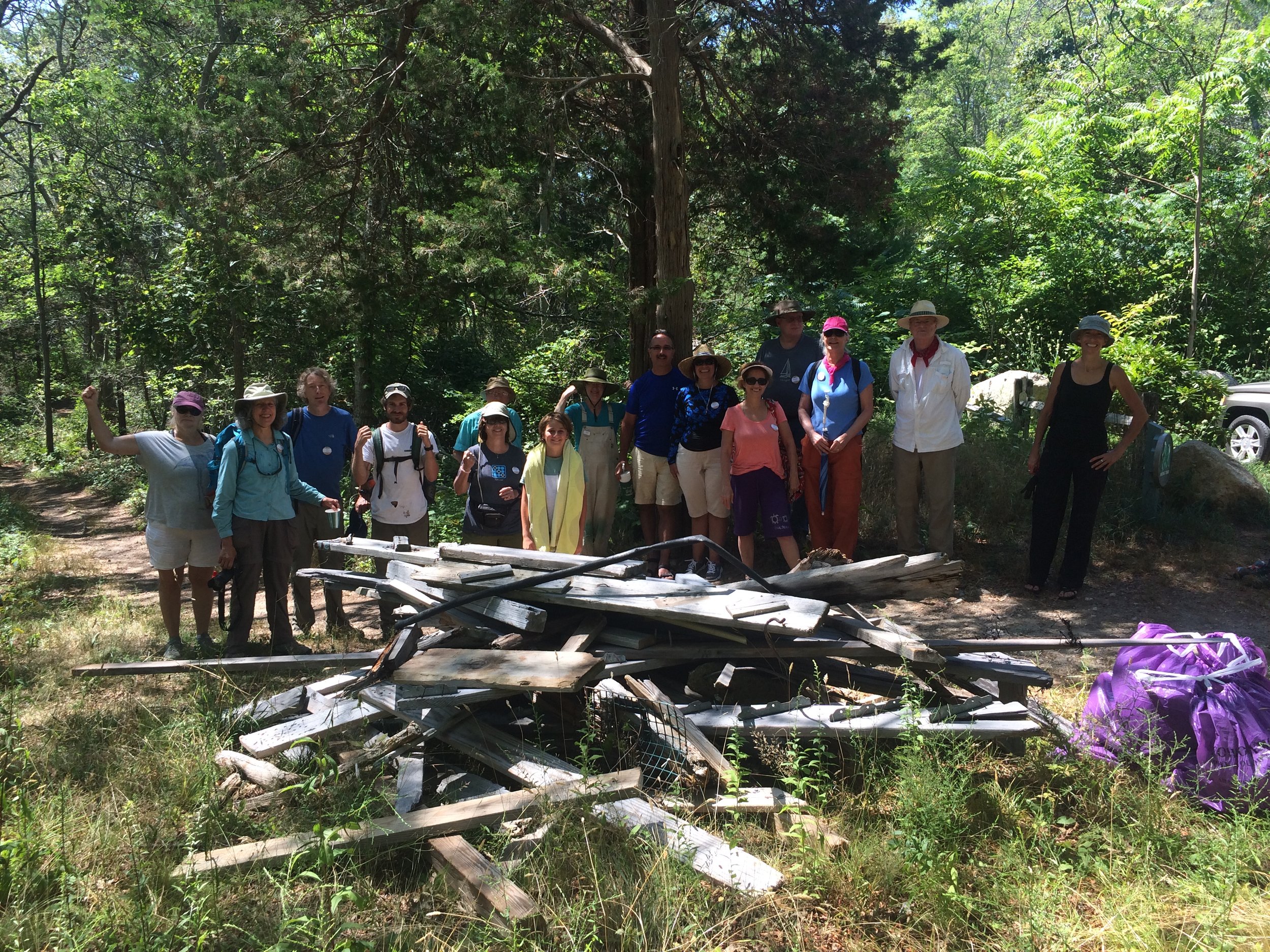  Sierra Club volunteers haul a washed up dock to the Center Hill Preserve trail head.