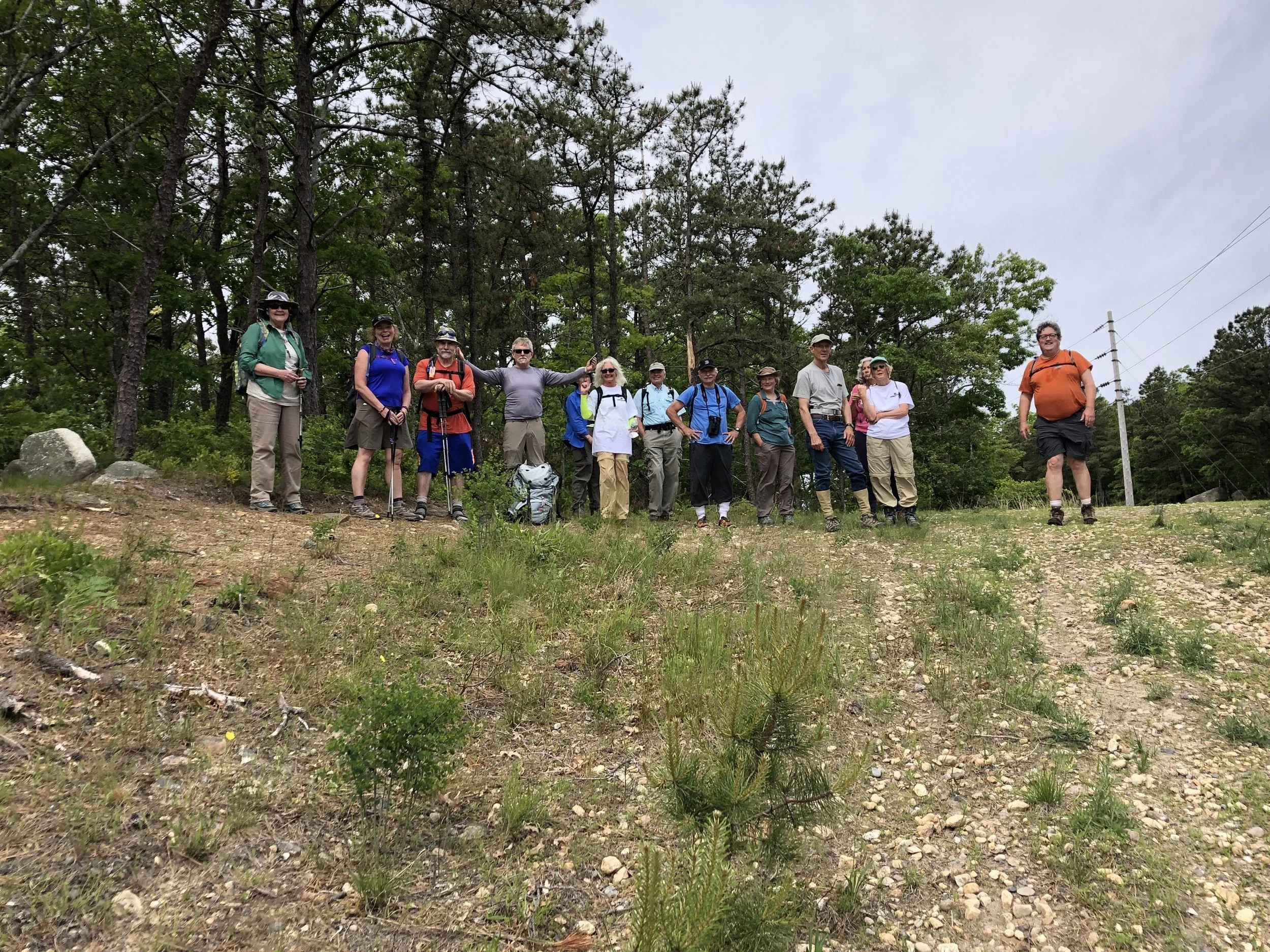 The Day One crew atop the geographic Pine Hills