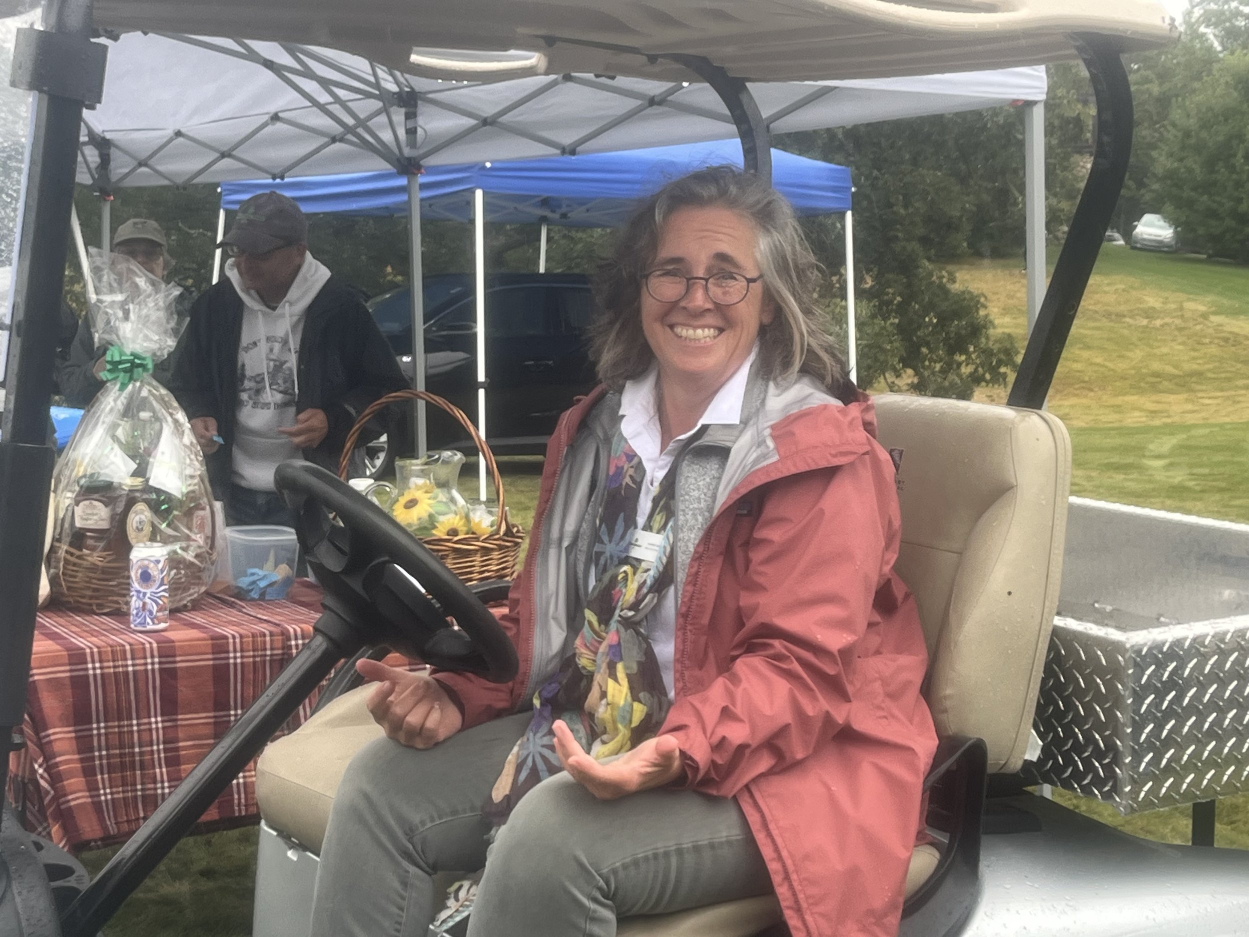 Wildlands President Karen Grey drives a golf cart.