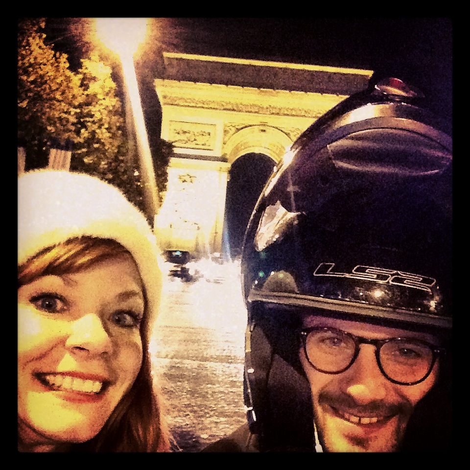  Me and a kind gentleman on his scooter taking a selfie with me at a stop light in from of the Arc de Triumph. 