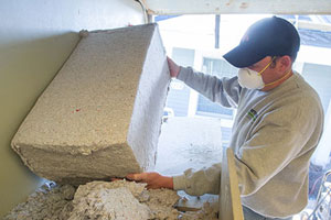 Chad-loading-cellulose-into-hopper-Harrisville-NH-farnum-insulators.jpg