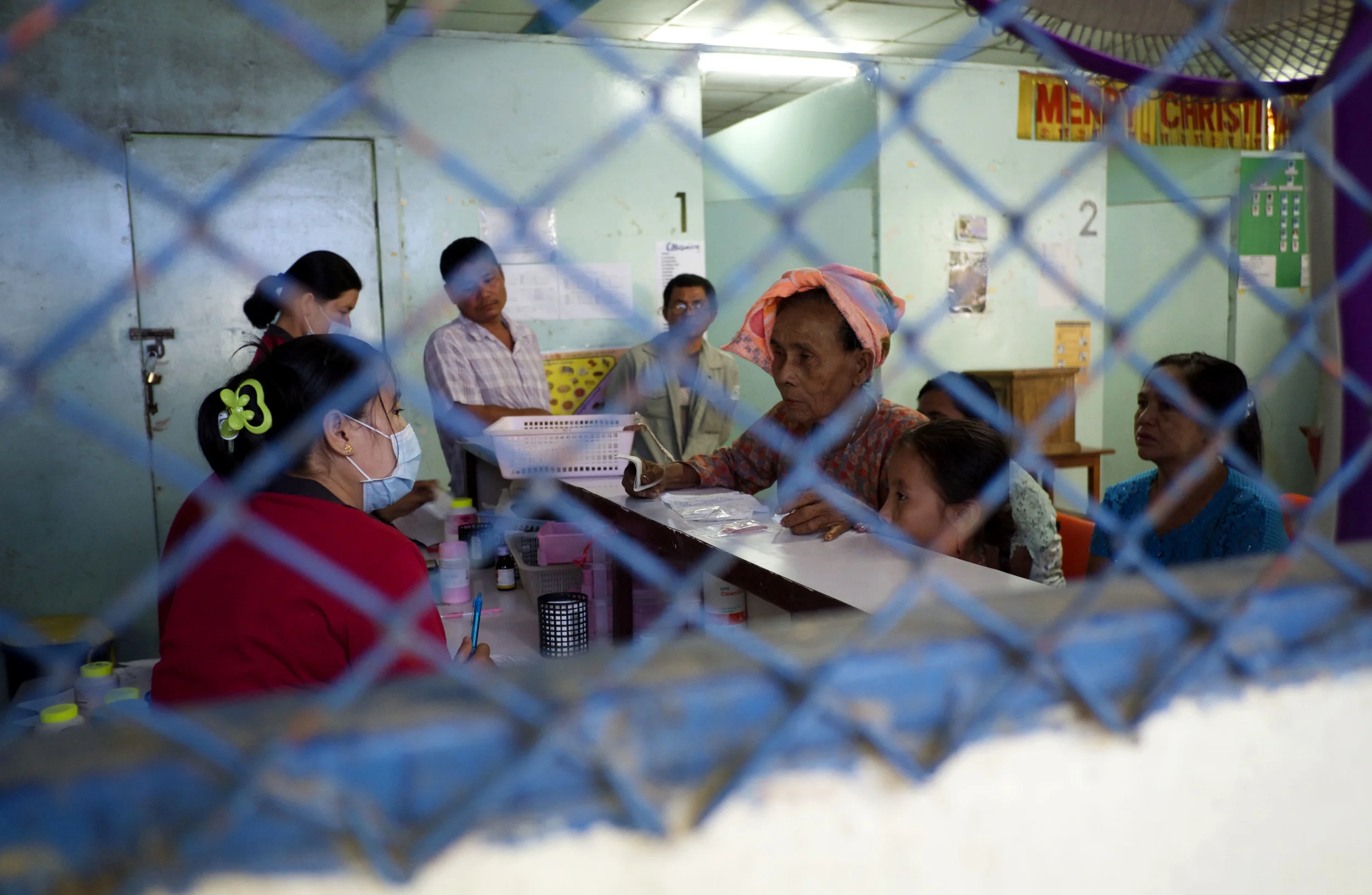 Patients wait at the pharmacy in Mae Tao Clinic for their medication. (Credit: Dene-Hern Chen)