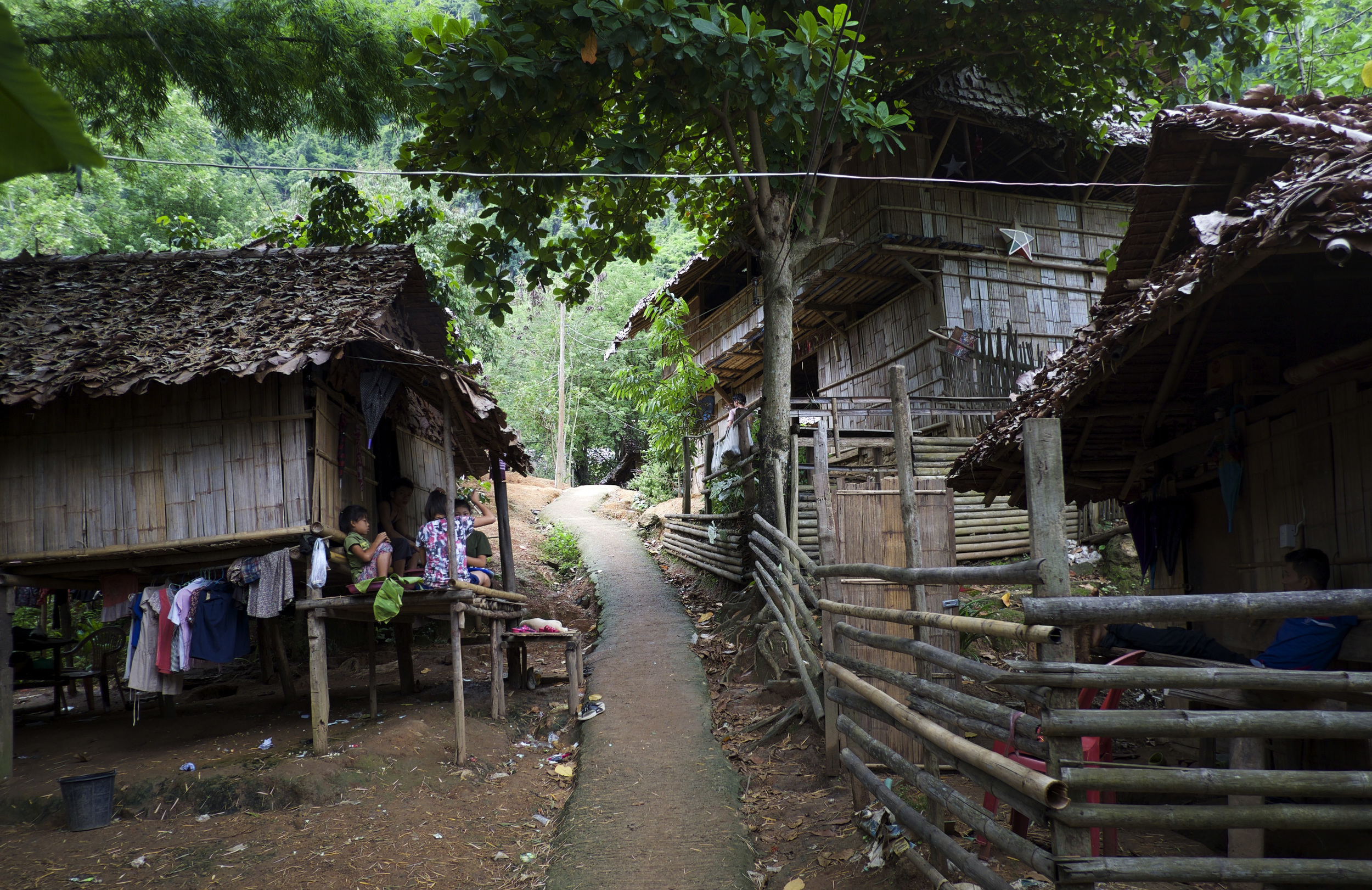 Children sit idly in their house in Mae La refugee camp, which currently shelters more than 40,000 people. (Credit: Dene-Hern Chen)