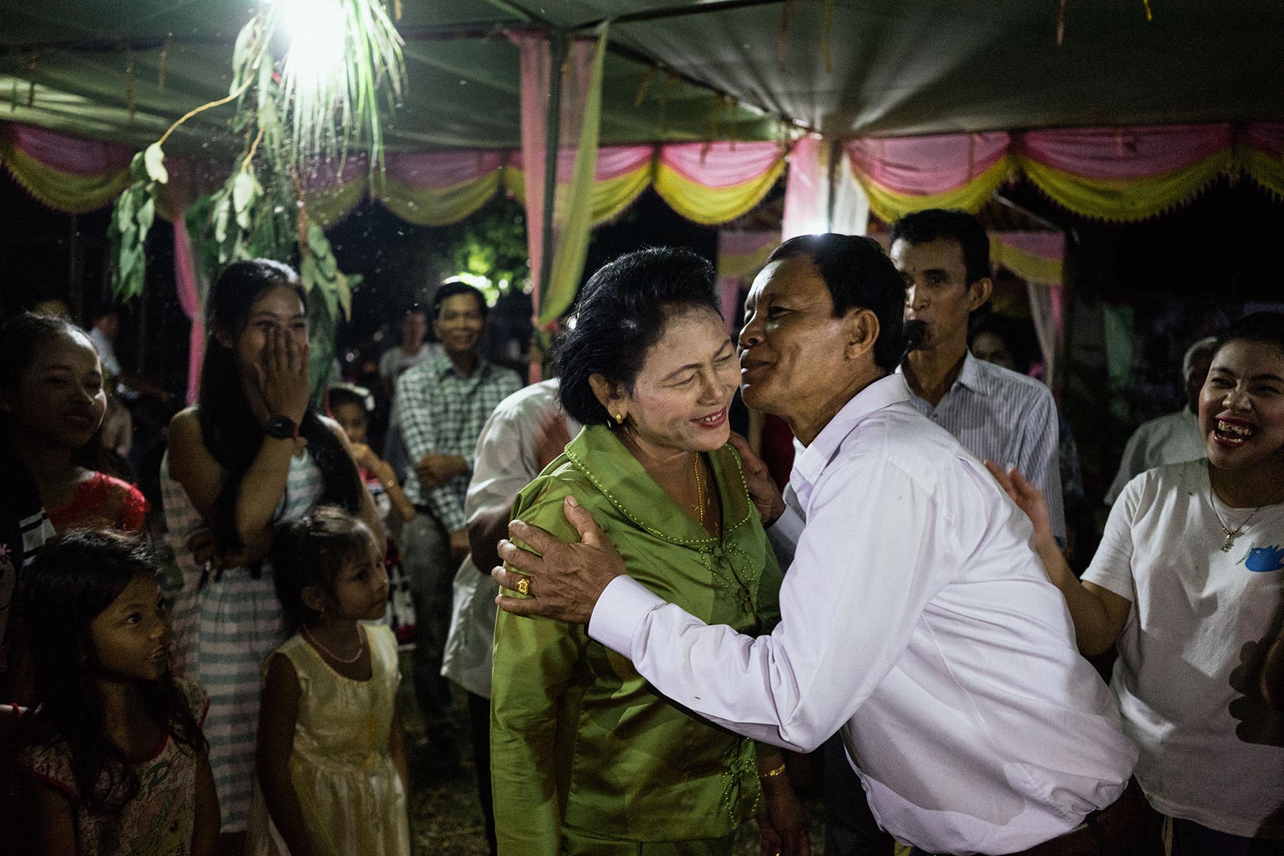 Kae Khan and Ly Lay Eun embrace amidst friends and family after the remarriage ceremony. 