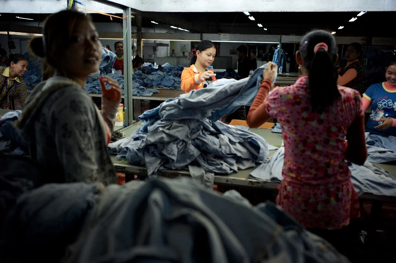 Workers sort clothing in a factory in Cambodia. (Credit: Ben Woods)