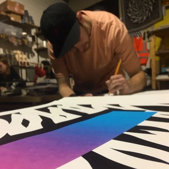 Mr Penfold signing the prints in his Bristol studio.