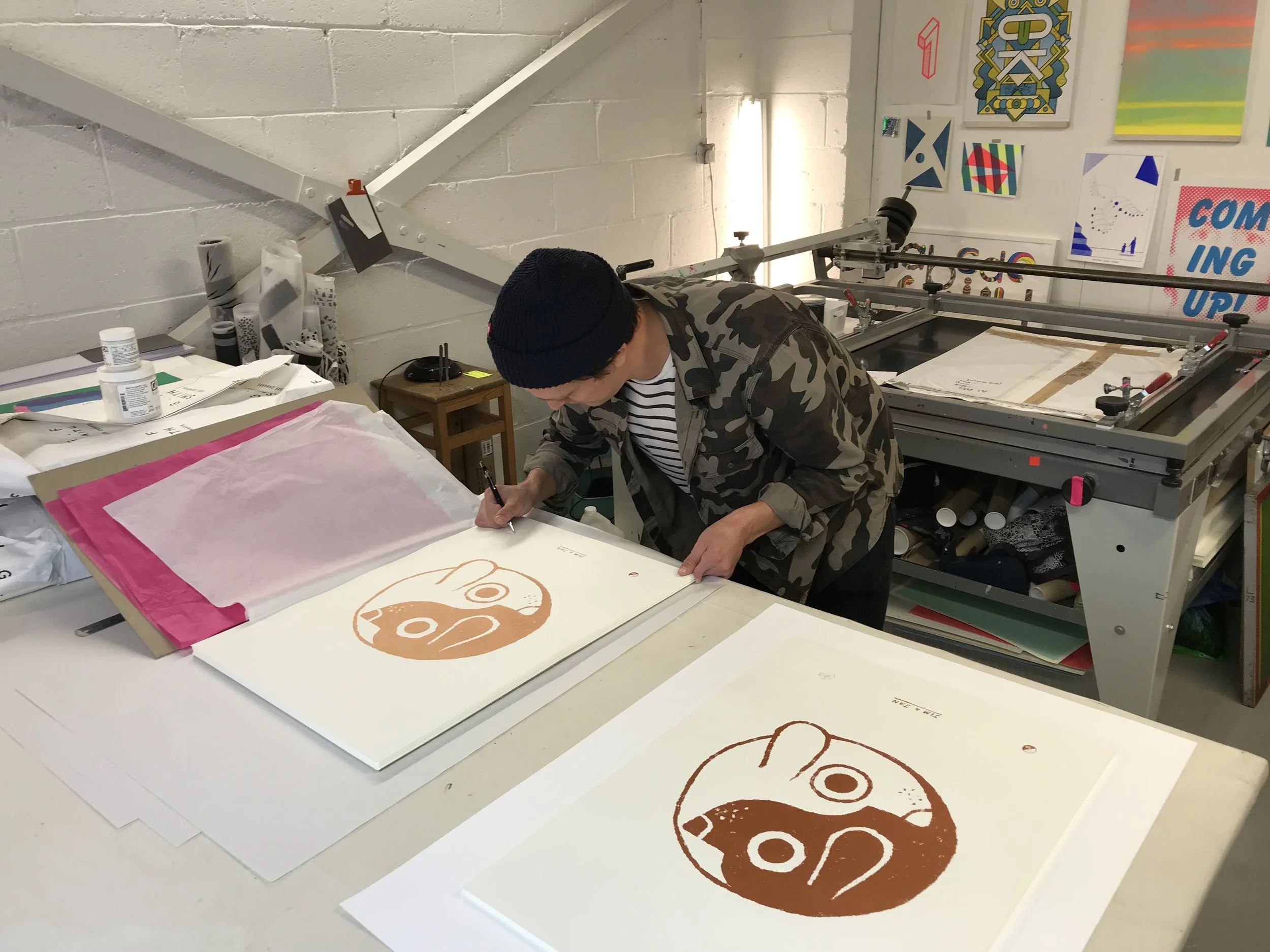 John signing the prints