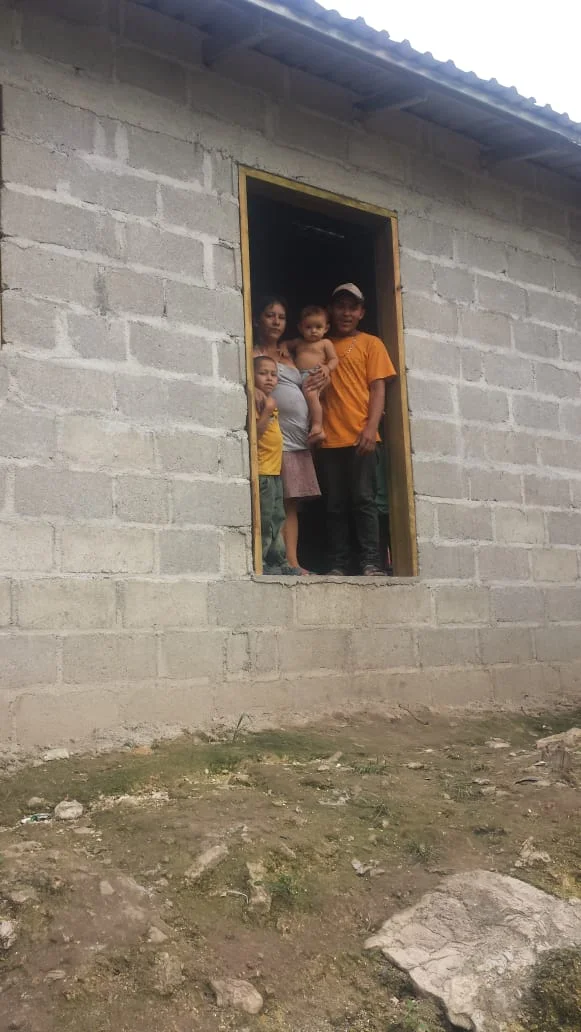 Selvin and Reina have 3 children: Heidy, Rosario and Yovany. Selvin is a farmer on the community plantation and works very hard to care for his family. He is so thankful to receive this home with a concrete floor and solid roof! 