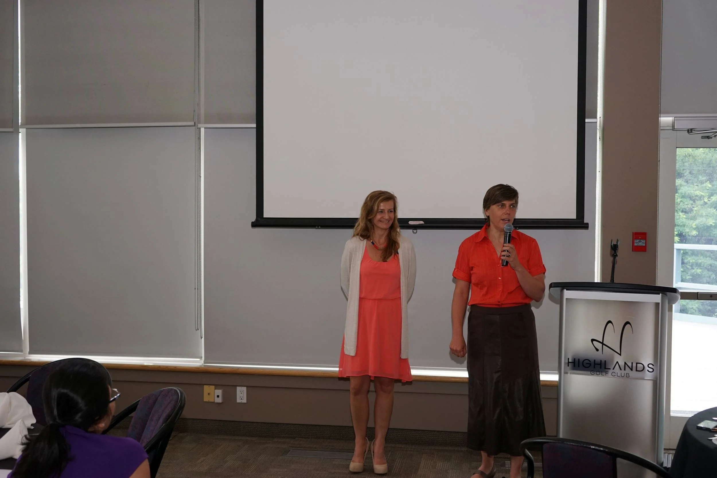 Trina Larsen presenting award of recognition to Tammy Brady