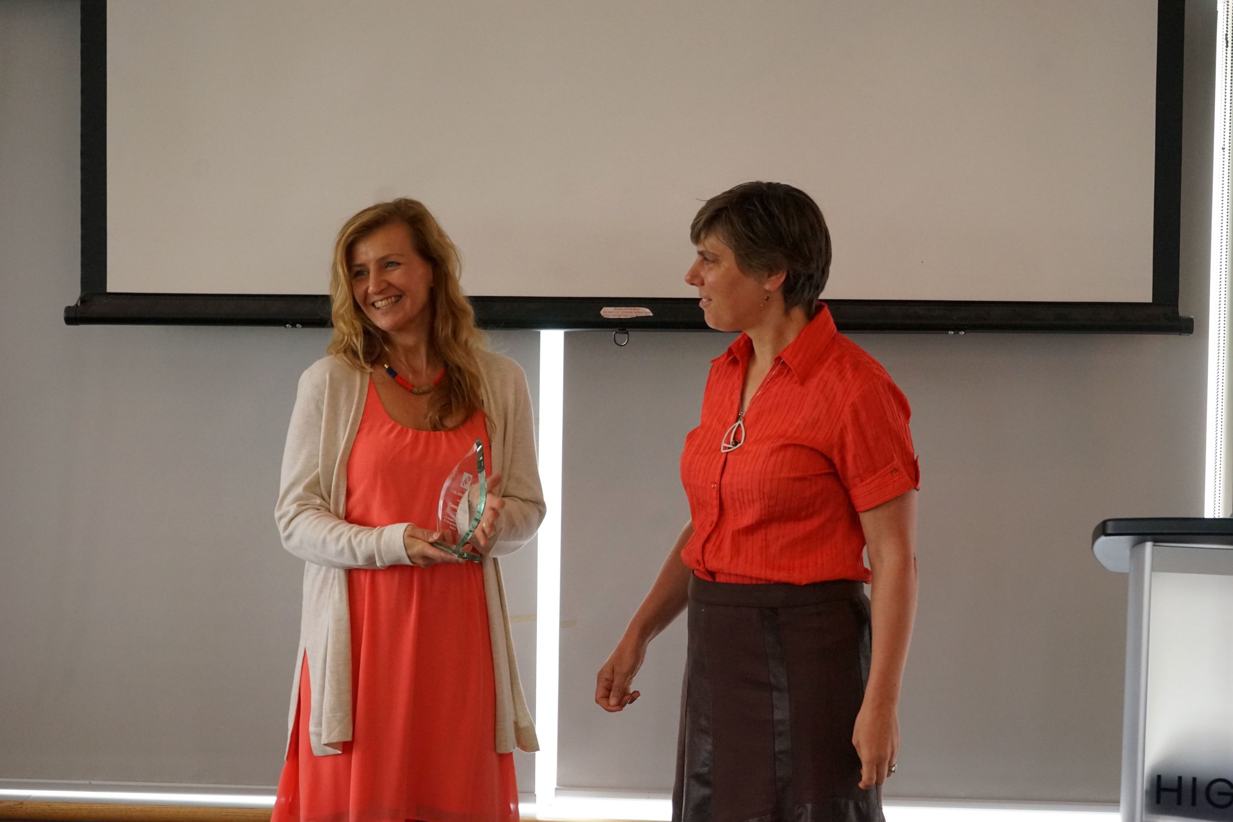 Trina Larsen presenting award of recognition to Tammy Brady