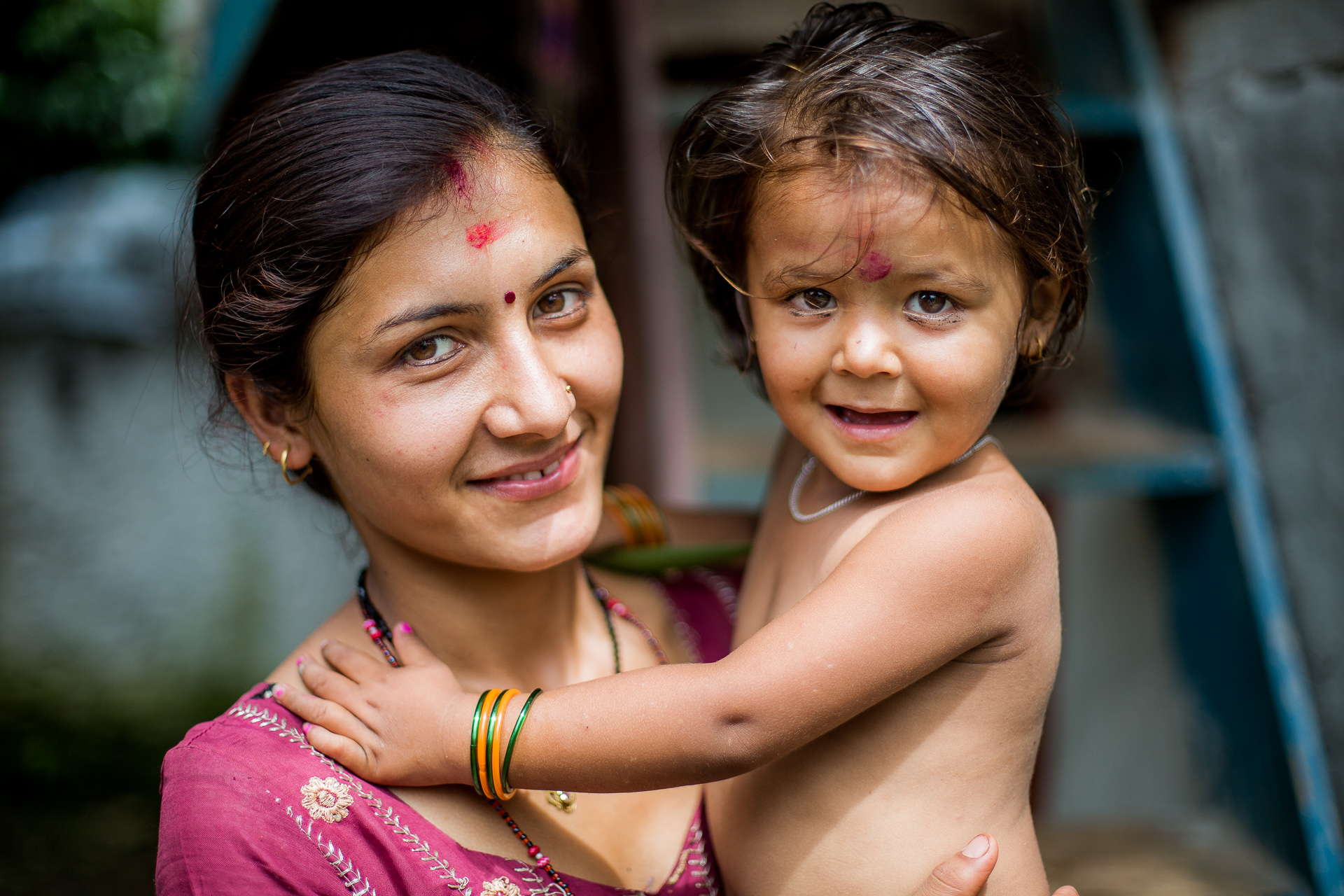 Caring mother proudly posing with her child. She was one of Rohit’s neighbours when he was living in this remote mountain village.