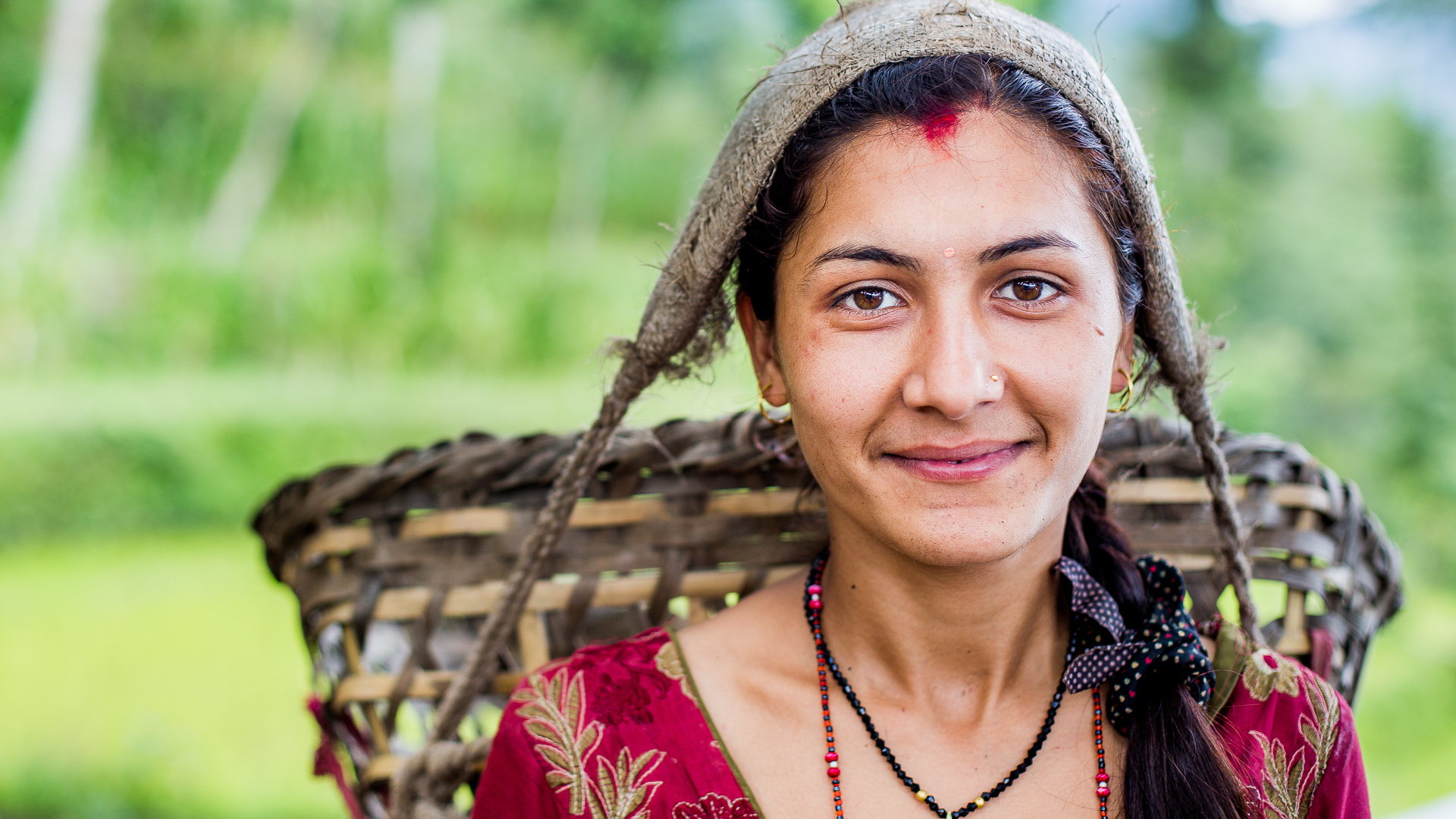 Girl, early morning, on her way to work in the fields. 