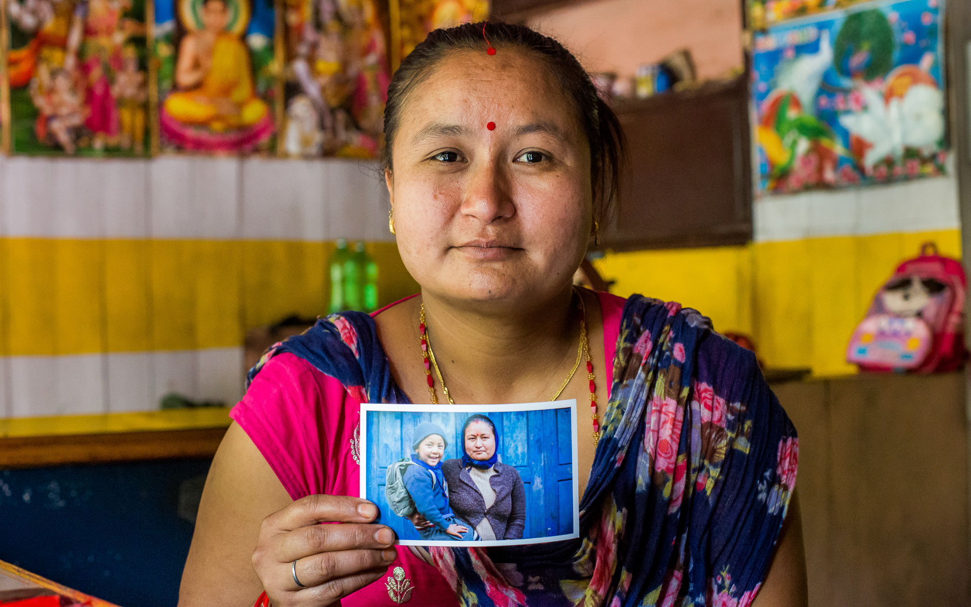 People from Necha village posing with their printed photos.
