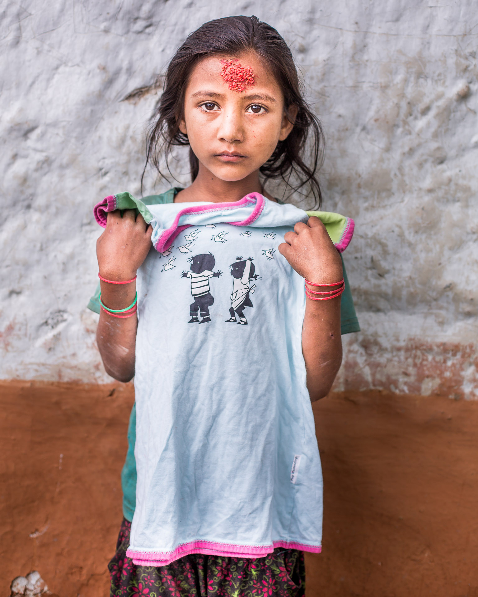 Happy with her Jip and Janneke t-shirt.