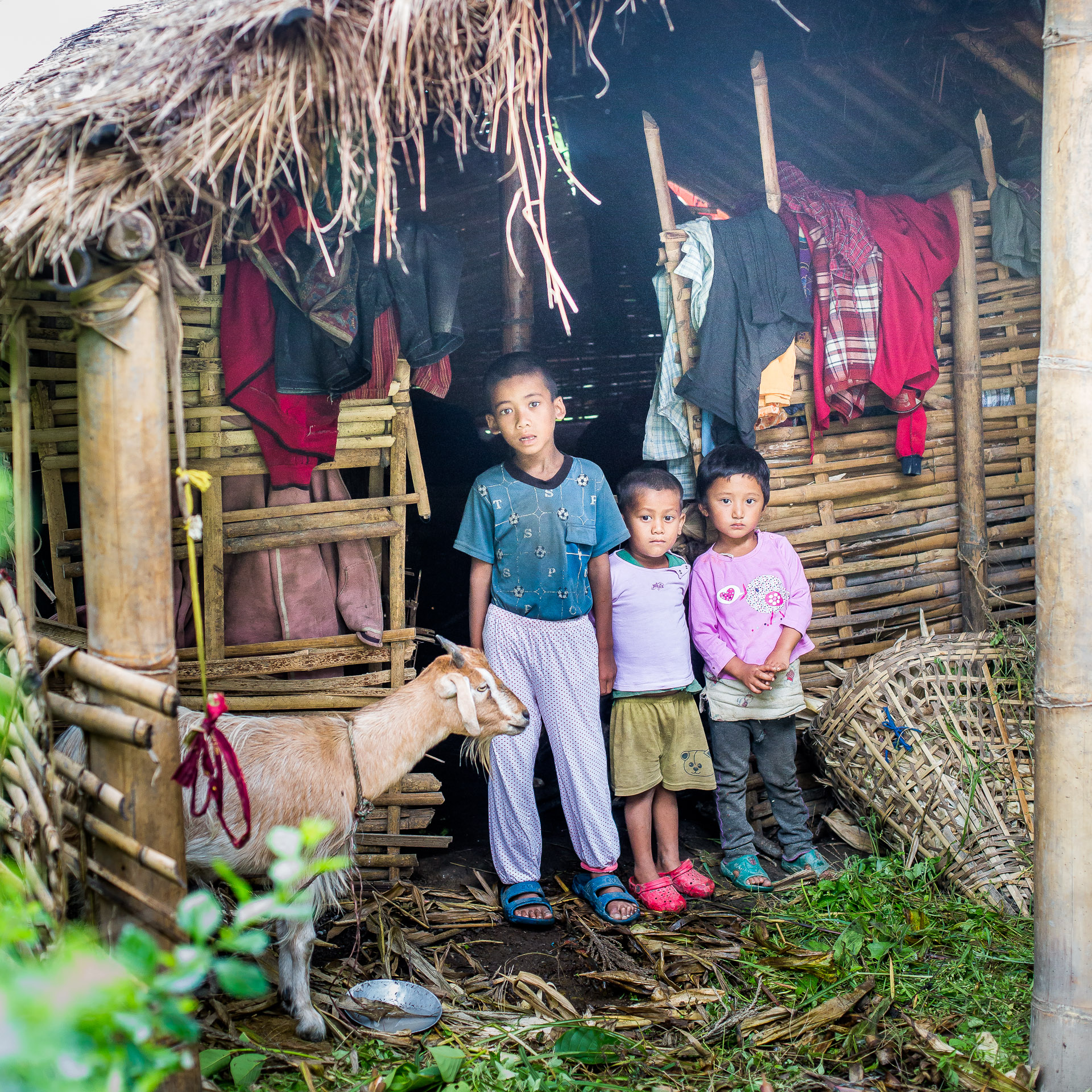 These 3 children all received new clothes from Micro-Care Nepal.