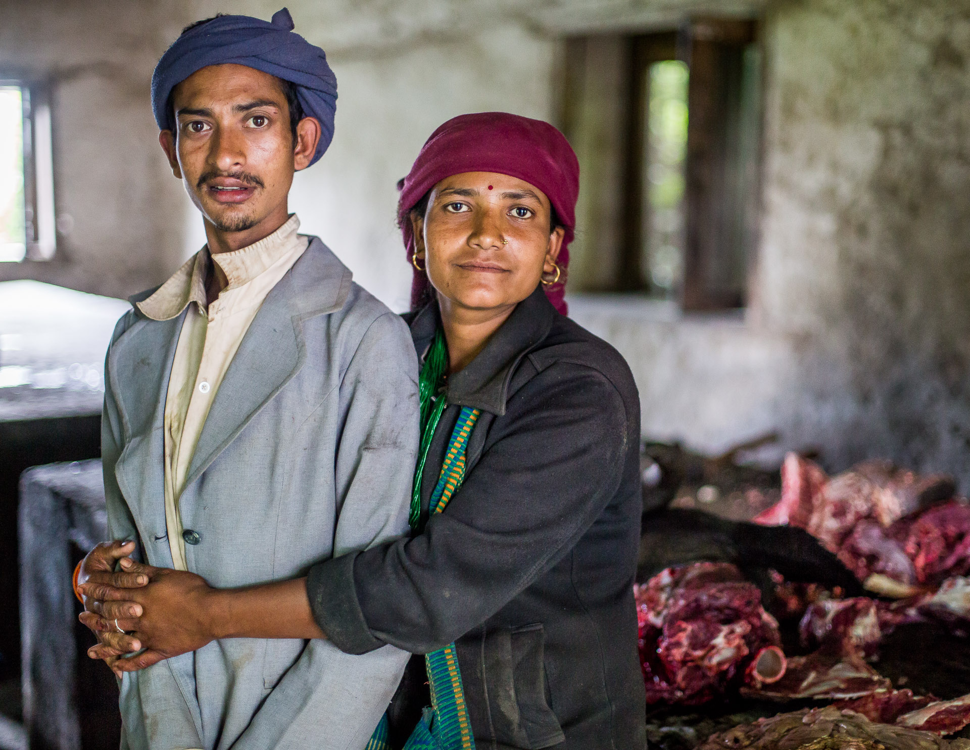 This husband and wife work every Thursday, butchering animals that are sold in the market. 