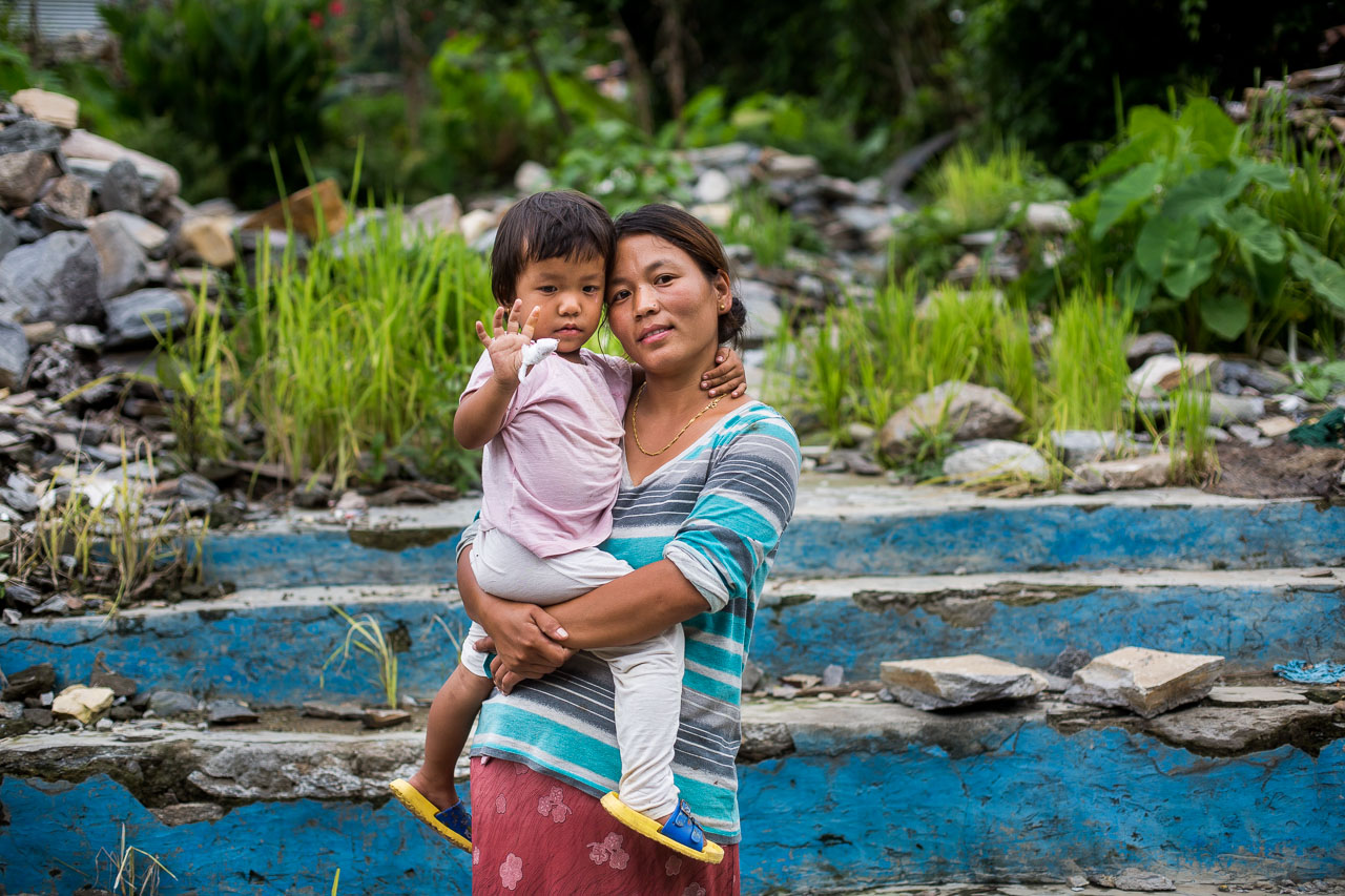 Posing in front of the ruins of her family’s house.