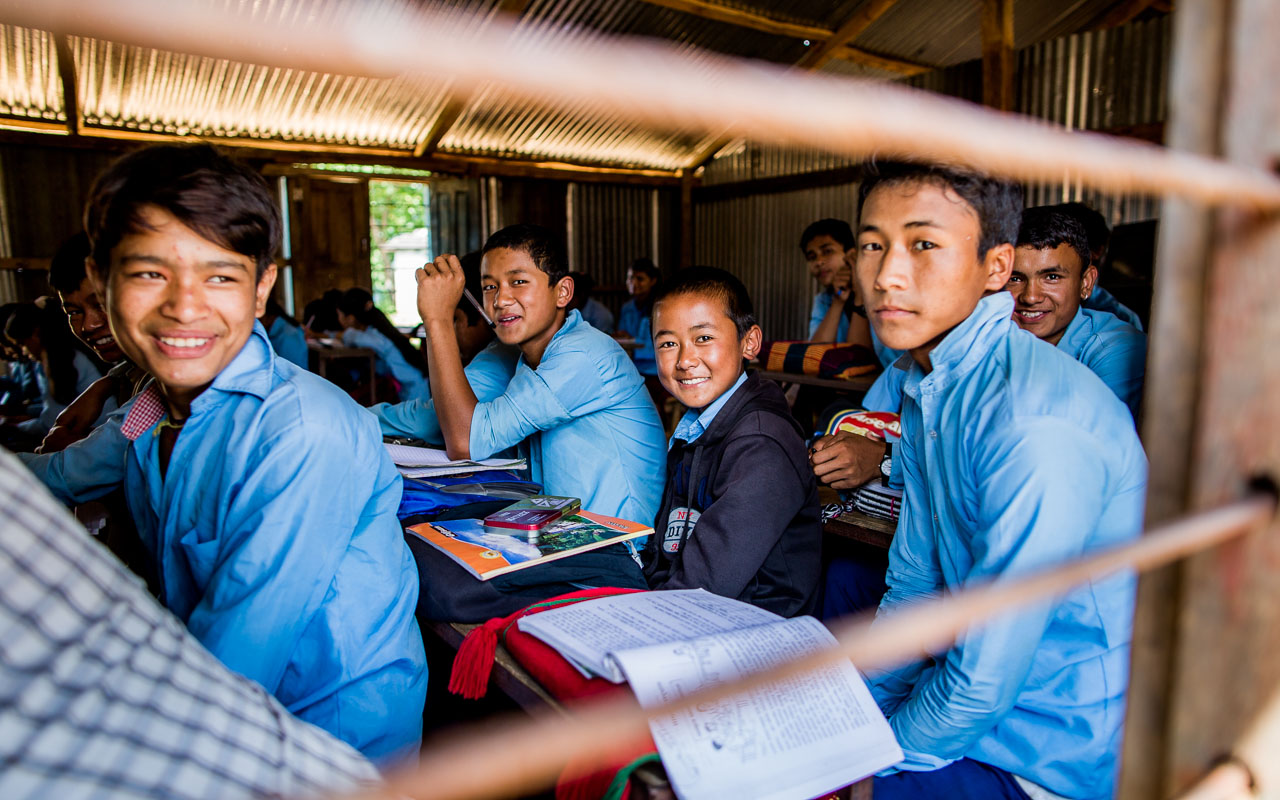 Photo taken from the outside of the school window of t he 8th class. School windows in Nepal are always covered by bars. 
